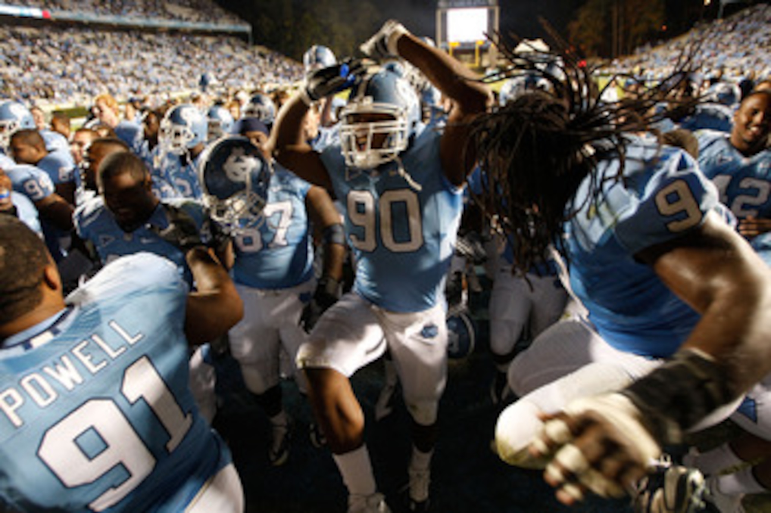 CHAPEL HILL, NC - NOVEMBER 07:  Quinton Coples #90 of the North Carolina Tar Heels celebrates with teammates after a 19-6 victory over the Duke Blue Devils during their game at Kenan Stadium on November 7, 2009 in Chapel Hill, North Carolina.  (Photo by S