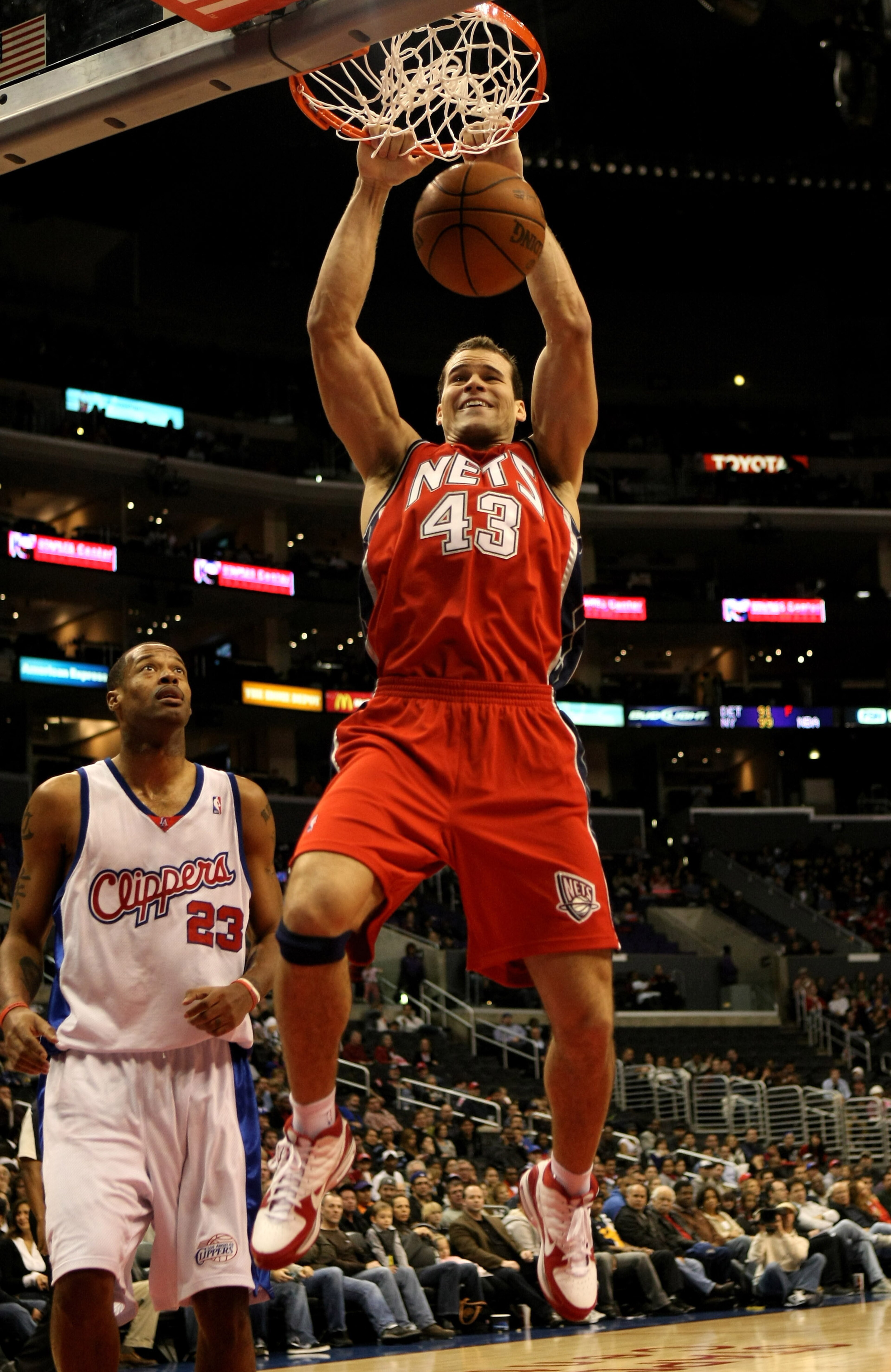 LOS ANGELES - JANUARY 18:   Chris Humphries #43 of the New Jersey Nets dunks over Marcus Camby #23 of the Los Angeles Clippers on January 18, 2010 at Staples Center in Los Angeles, California. The Clippers won 106-95.  NOTE TO USER: User expressly acknowl