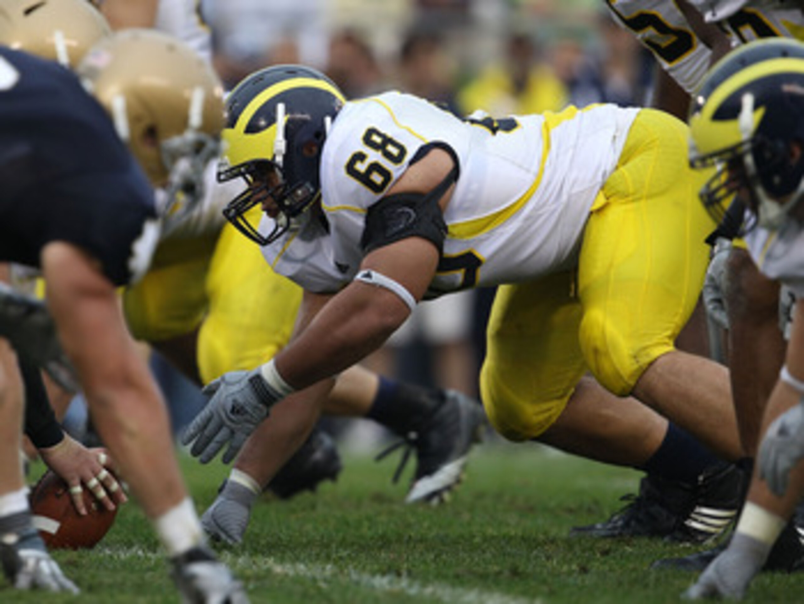 SOUTH BEND, IN - SEPTEMBER 11: Mike Martin #68 of the Michigan Wolverines awaits the start of play against the Notre Dame Fighting Irish at Notre Dame Stadium on September 11, 2010 in South Bend, Indiana. Michigan defeated Notre Dame 28-24.  (Photo by Jon