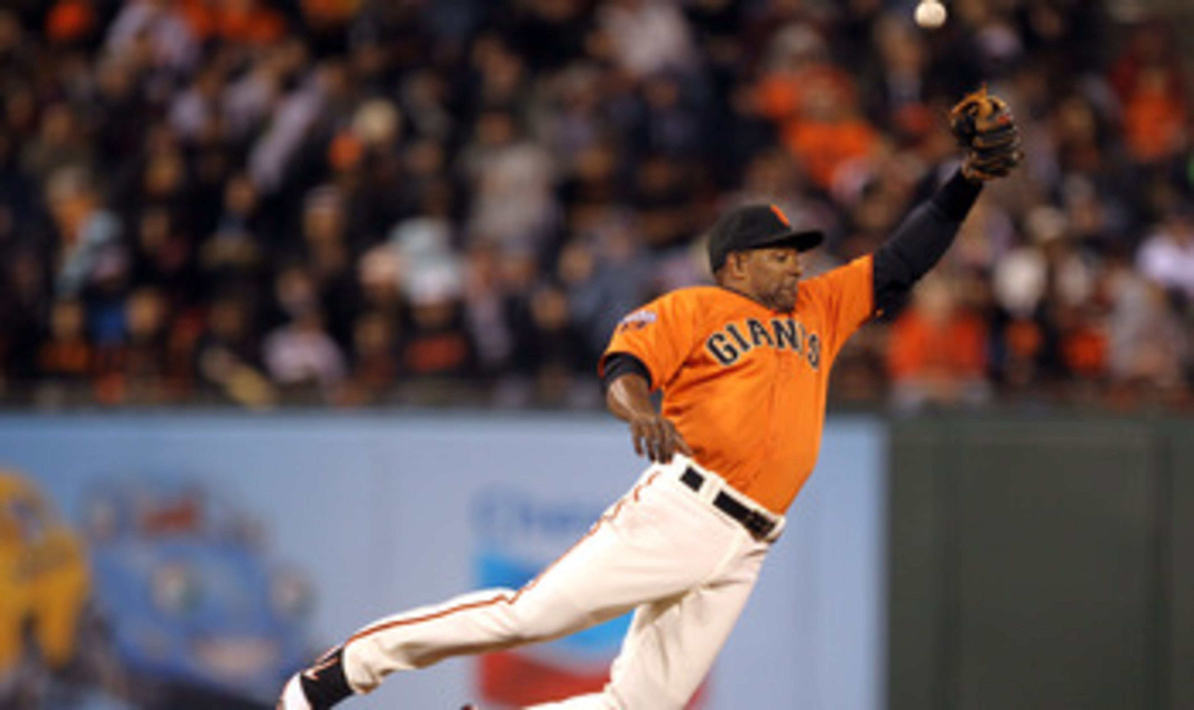 SAN FRANCISCO, CA - MAY 06:  Miguel Tejada #10 of the San Francisco Giants can't catch a ball hit by Todd Helton #17 of the Colorado Rockies at AT&T Park on May 6, 2011 in San Francisco, California.  (Photo by Ezra Shaw/Getty Images)