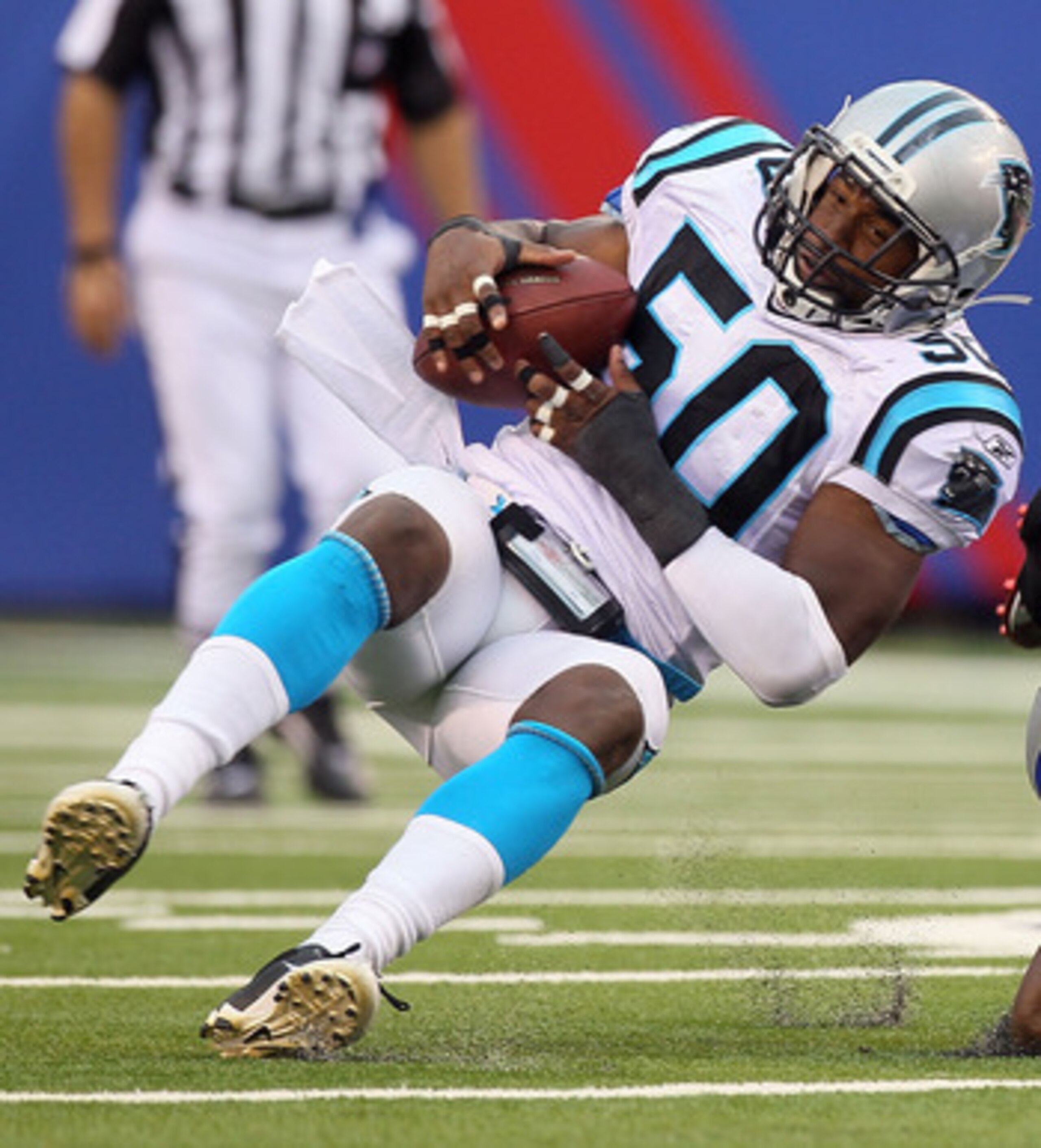 EAST RUTHERFORD, NJ - SEPTEMBER 12:  James Anderson #50 of the Carolina Panthers intercepts a pass intended for Ahmad Bradshaw #44 of the New York Giants on September 12, 2010 at the New Meadowlands Stadium in East Rutherford, New Jersey.  (Photo by Jim M