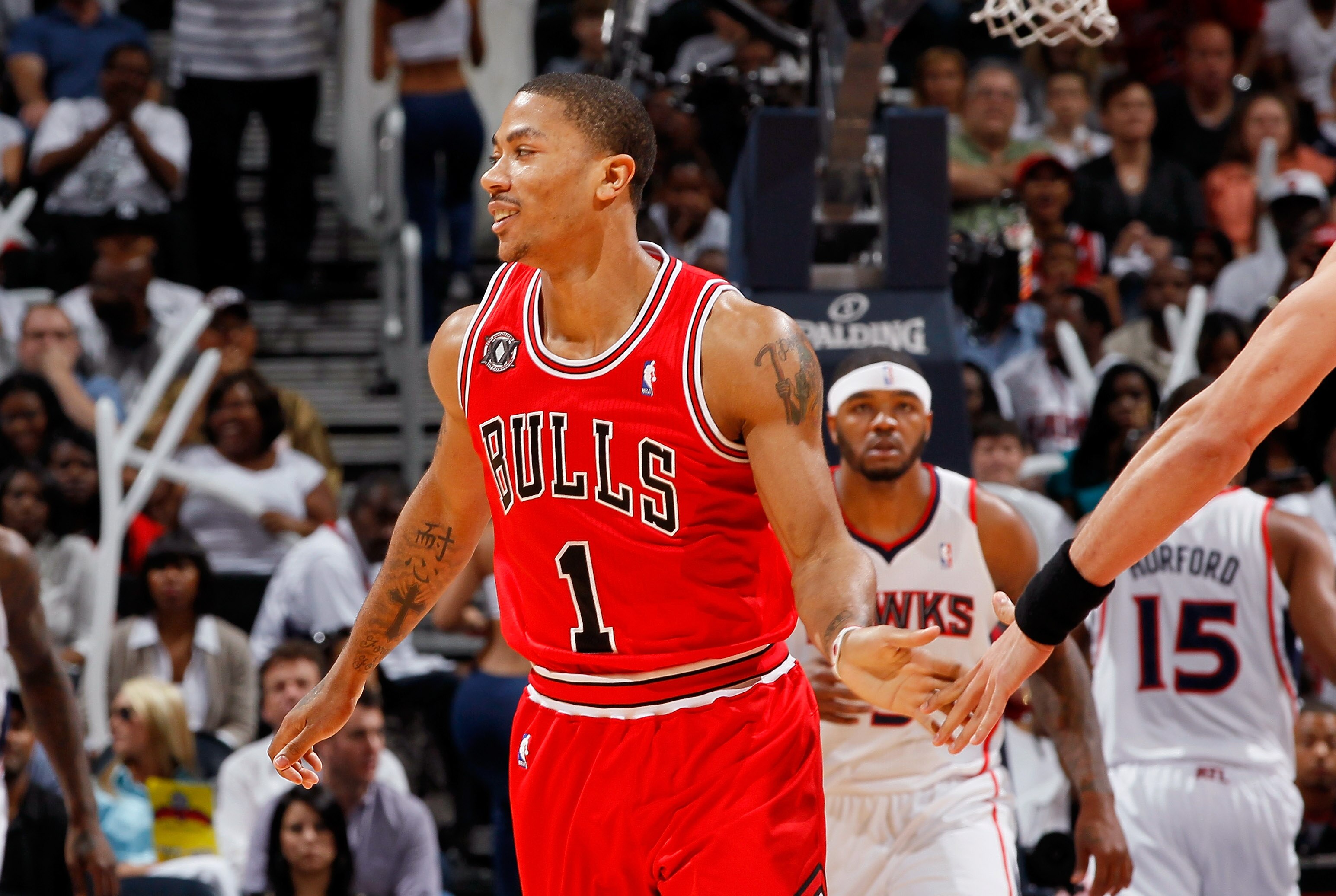 ATLANTA, GA - MAY 06:  Derrick Rose #1 of the Chicago Bulls reacts after hitting a three-point basket against the Atlanta Hawks in Game Three of the Eastern Conference Semifinals in the 2011 NBA Playoffs at Phillips Arena on May 6, 2011 in Atlanta, Georgi