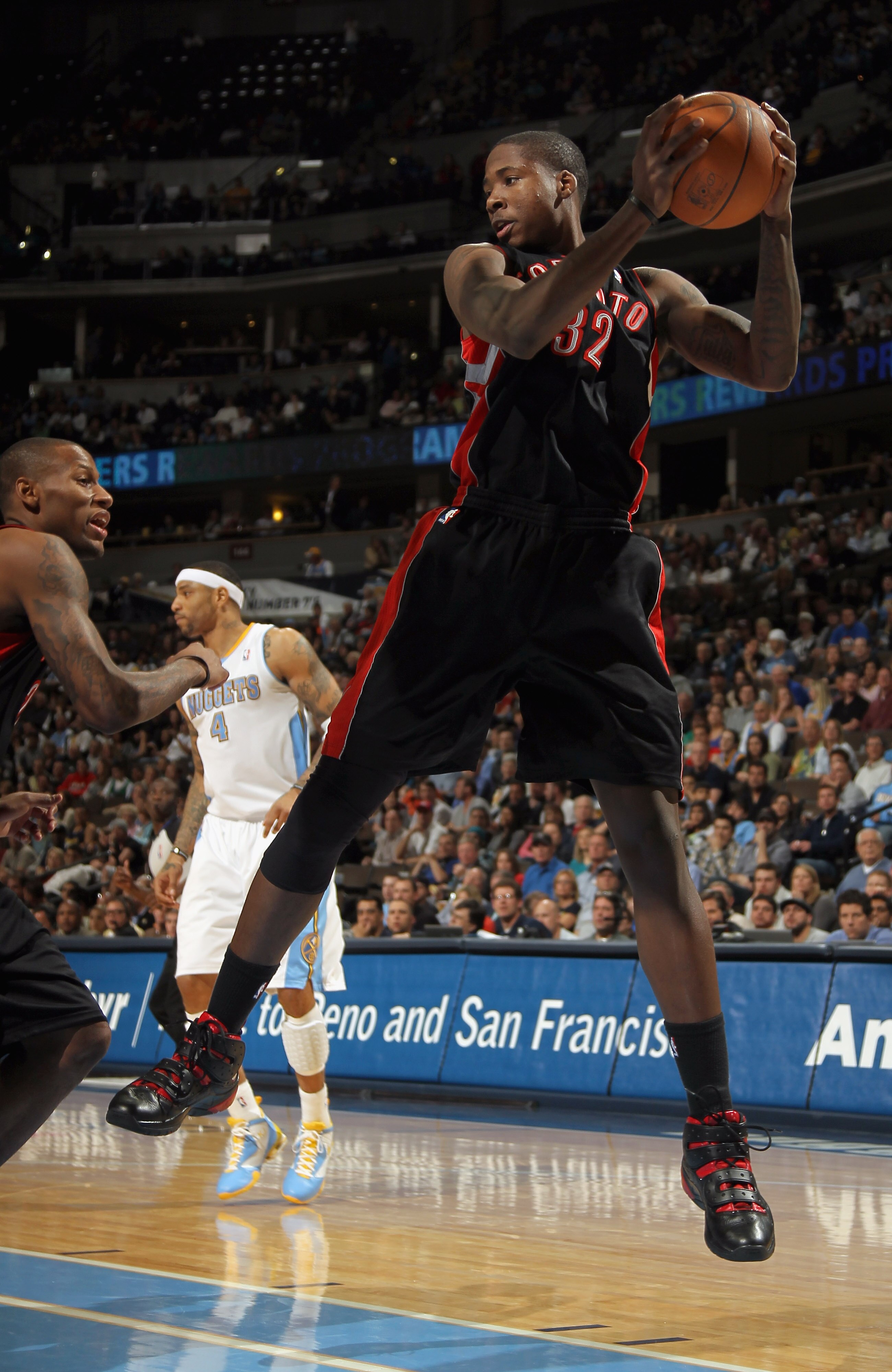 DENVER, CO - MARCH 21:  Ed Davis #32 of the Toronto Raptors grabs a rebound against the Denver Nuggets at the Pepsi Center on March 21, 2011 in Denver, Colorado. The Nuggets defeated the Raptors 123-90. NOTE TO USER: User expressly acknowledges and agrees