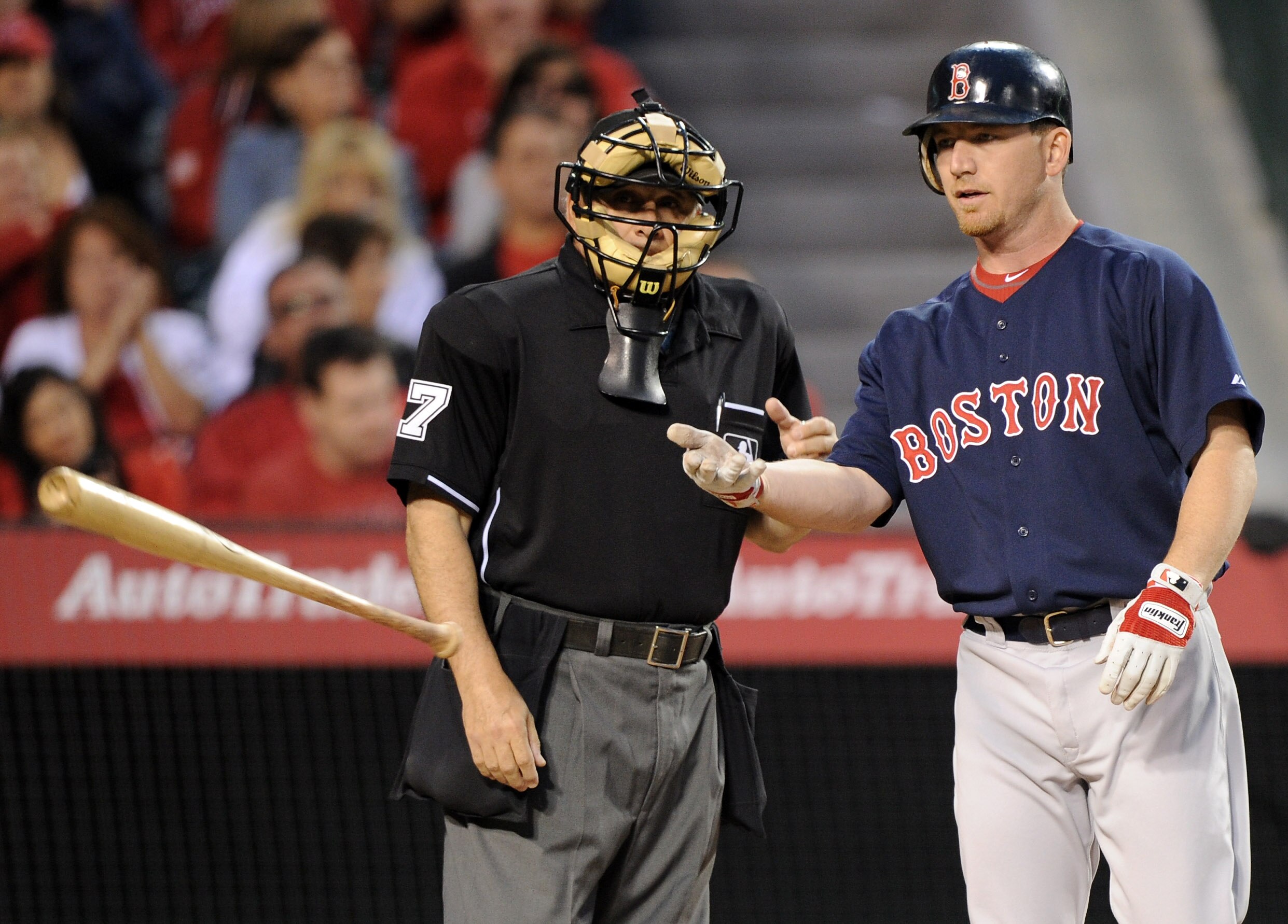 ANAHEIM, CA - APRIL 22:  J.D. Drew #7 of the Boston Red Sox reacts to a called strikeout at the plate in front of home plate unpire Larry Vanover #17 against the Los Angeles Angels of Anaheim during the second inning at Angel Stadium on April 22, 2011 in