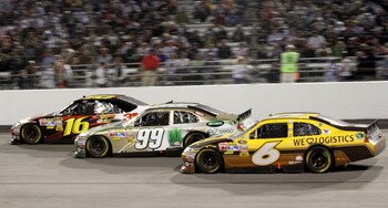 RICHMOND, VA - APRIL 30: David Ragan, driver of the #6 UPS Ford races with Carl Edwards, driver of the #99 Scotts eZ Seed Ford and Greg Biffle, driver of the #16 3M Ford during the NASCAR Sprint Cup Series Crown Royal Presents The Matthew & Daniel Hansen