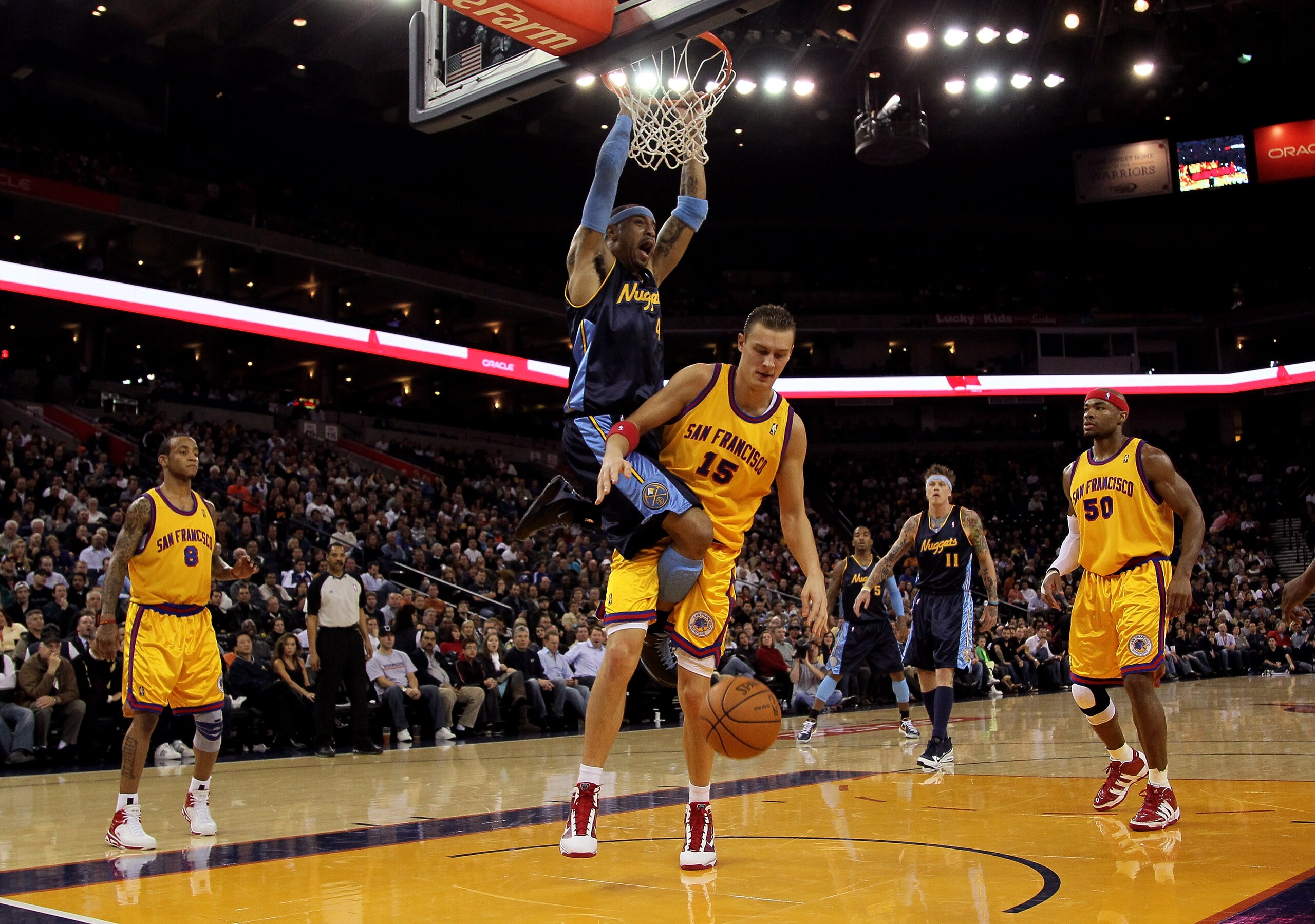 OAKLAND, CA - JANUARY 20:  Kenyon Martin #4 of the Denver Nuggets dunks on Andris Biedrins #15 of the Golden State Warriors at Oracle Arena on January 20, 2010 in Oakland, California.  NOTE TO USER: User expressly acknowledges and agrees that, by download