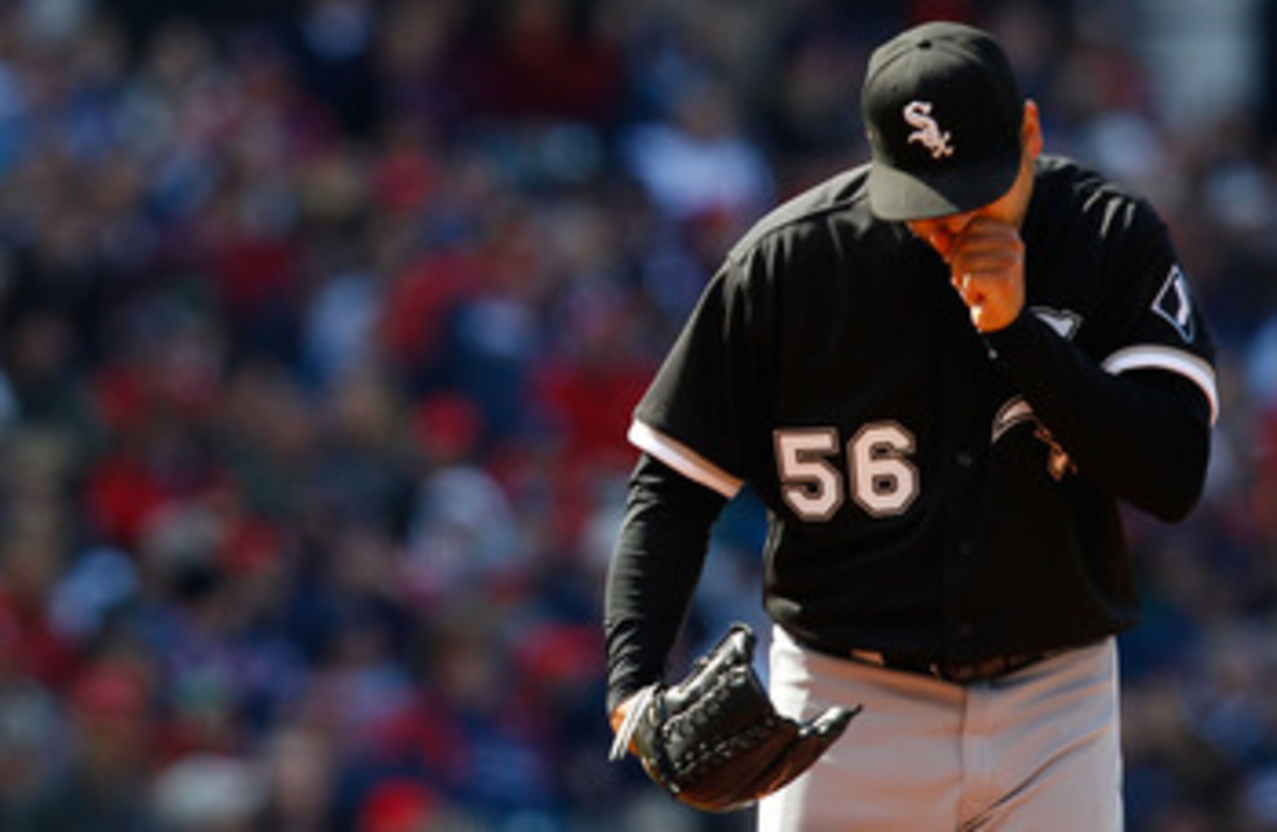 CLEVELAND - APRIL 01: Mark Buehrle #56 of the Chicago White Sox warms his hands during the Opening Day game against the Cleveland Indians on April 1, 2011 at Progressive Field in Cleveland, Ohio. The high temperature in Cleveland only reached 44 degrees. CLEVELAND - APRIL 01: Mark Buehrle #56 of the Chicago White Sox warms his hands during the Opening Day game against the Cleveland Indians on April 1, 2011 at Progressive Field in Cleveland, Ohio. The high temperature in Cleveland only reached 44 degrees.