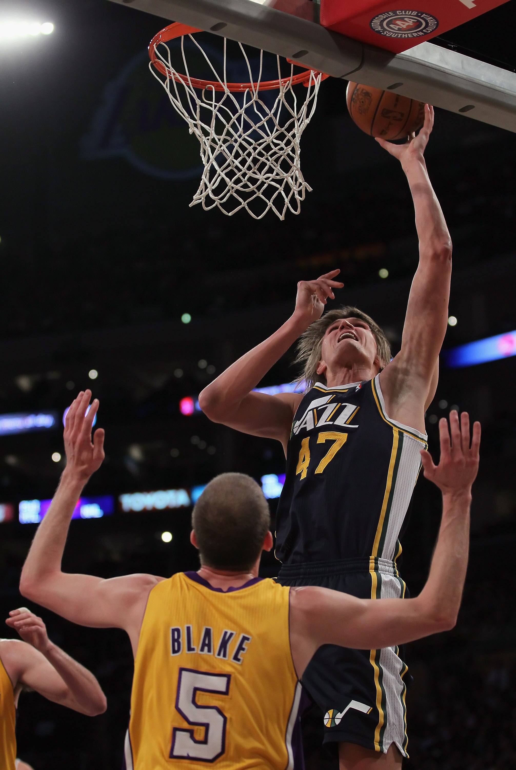 LOS ANGELES, CA - JANUARY 25:  Andrei Kirilenko #47 of the Utah Jazz drives to the basket over Steve Blake #5 of the Los Angeles Lakers in the first half at Staples Center on January 25, 2011 in Los Angeles, California. The Lakers defeated the Jazz 120-91
