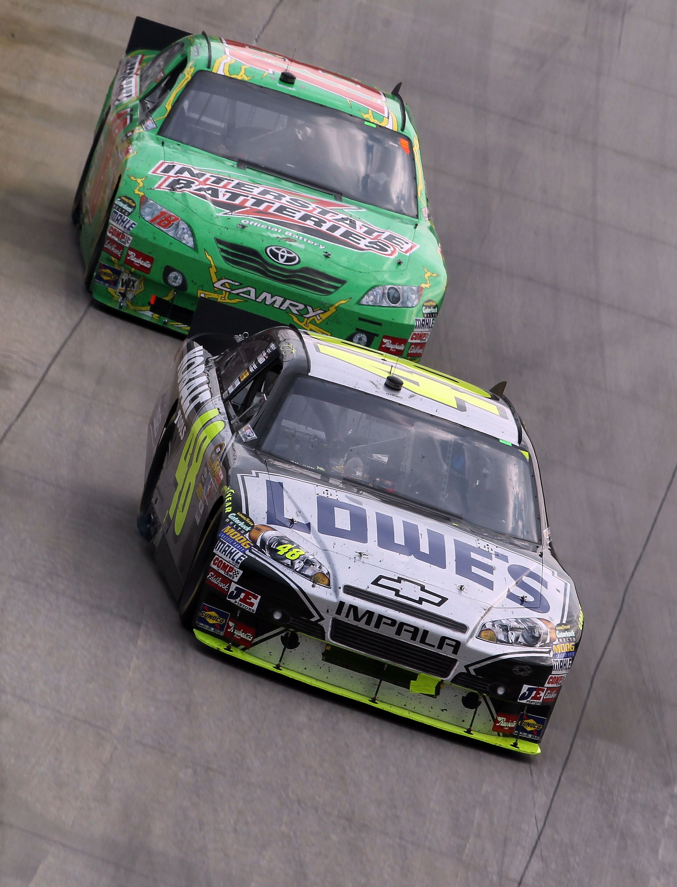 DOVER, DE - SEPTEMBER 26:  Jimmie Johnson drives the #48 Lowe's Chevrolet ahead of Kyle Busch, driver of the #18 Interstate Batteries Toyota, during the NASCAR Sprint Cup Series AAA 400 at Dover International Speedway on September 26, 2010 in Dover, Delaw