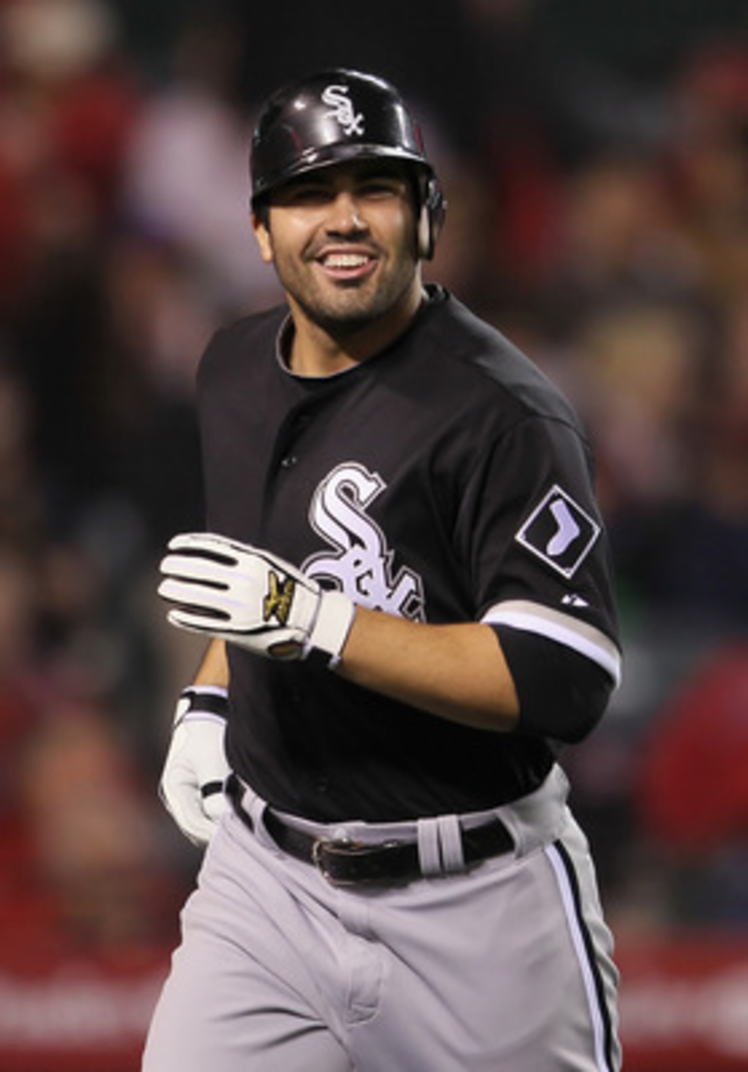 ANAHEIM, CA - MAY 09: Carlos Quentin #20 of the Chicago White Sox smiles after hitting a three-run home run against the Los Angeles Angels of Anaheim in the seventh inning at Angel Stadium of Anaheim on May 9, 2011 in Anaheim, California. The White Sox d ANAHEIM, CA - MAY 09: Carlos Quentin #20 of the Chicago White Sox smiles after hitting a three-run home run against the Los Angeles Angels of Anaheim in the seventh inning at Angel Stadium of Anaheim on May 9, 2011 in Anaheim, California. The White Sox d