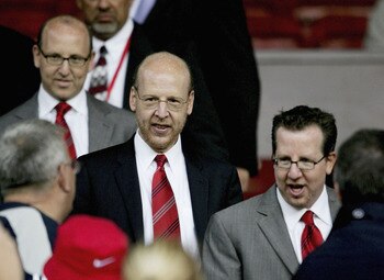 MANCHESTER, ENGLAND-AUGUST 9 : (L to R) Joel Glazer, Avram Glazer and Bryan Glazer, sons of owner Malcolm Glazer, are seen before the Champions League third qualifying round, first leg match between Manchester United and Debreceni VSC at Old Trafford on A