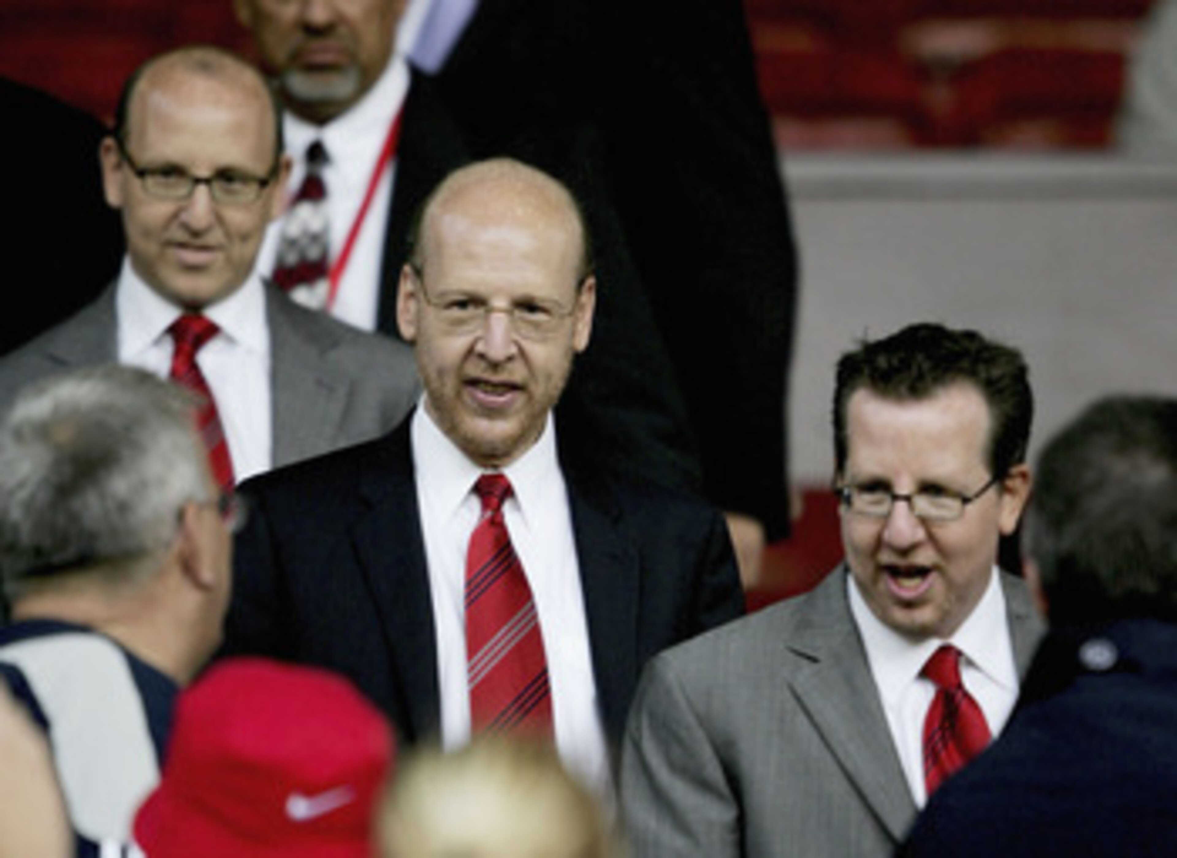 MANCHESTER, ENGLAND-AUGUST 9 : (L to R) Joel Glazer, Avram Glazer and Bryan Glazer, sons of owner Malcolm Glazer, are seen before the Champions League third qualifying round, first leg match between Manchester United and Debreceni VSC at Old Trafford on A