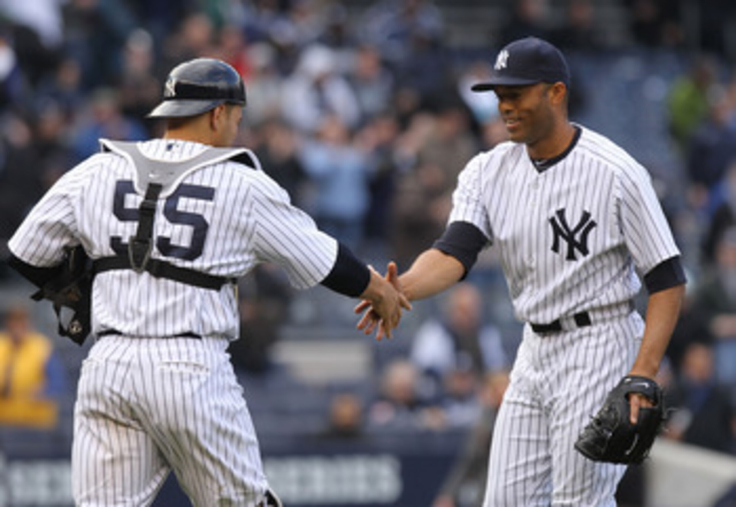 NEW YORK, NY - APRIL 07: Mariano Rivera #42 of the New York Yankees celebrates the win with catrcher Russell Martin #55 against the Minnesota Twins at Yankee Stadium on April 7, 2011 in the Bronx borough of New York City. (Photo by Nick Laham/Getty Imag NEW YORK, NY - APRIL 07: Mariano Rivera #42 of the New York Yankees celebrates the win with catrcher Russell Martin #55 against the Minnesota Twins at Yankee Stadium on April 7, 2011 in the Bronx borough of New York City. (Photo by Nick Laham/Getty Imag