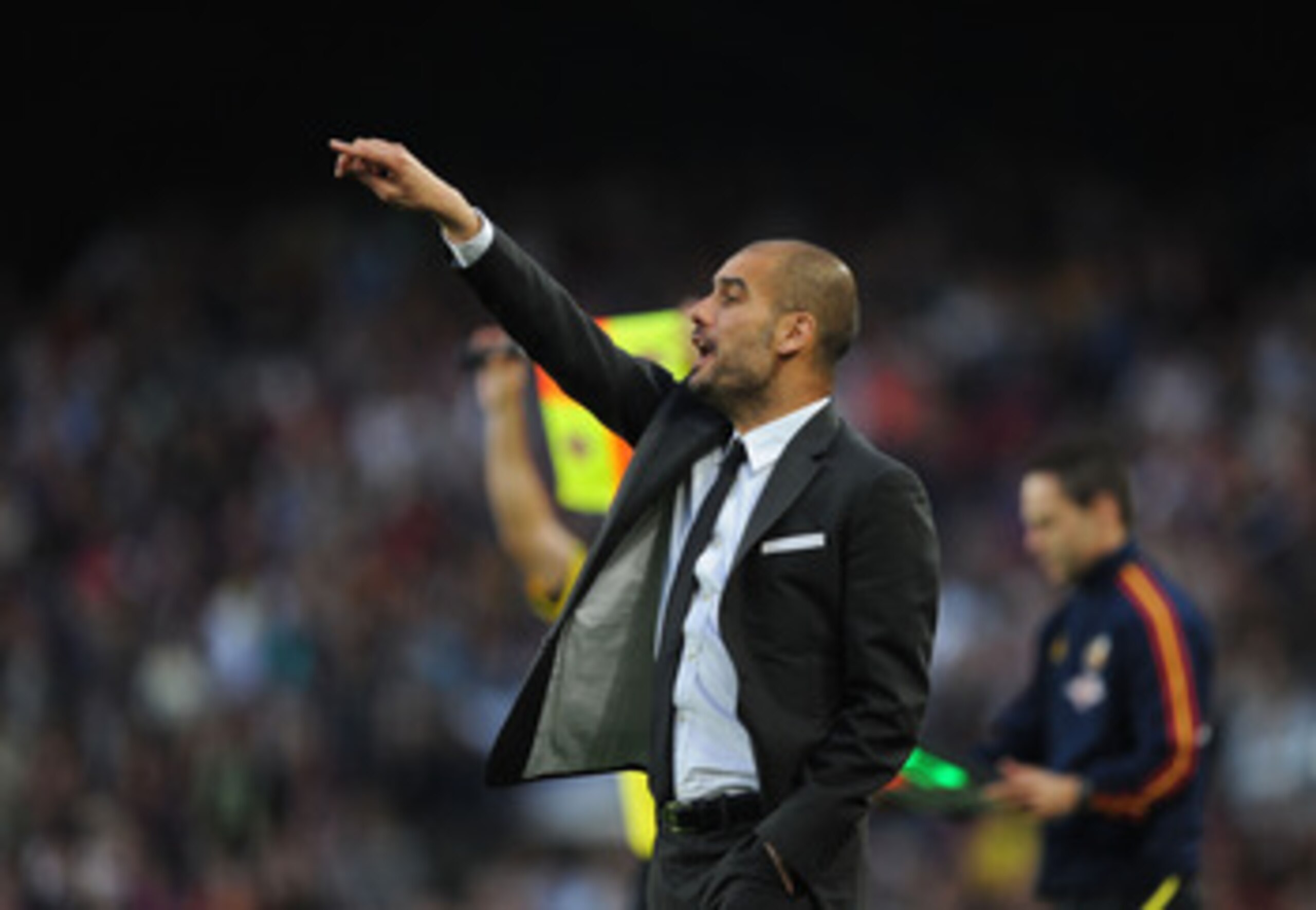 BARCELONA, SPAIN - MAY 08:  Head coach Josep Guardiola of Barcelona signals to a player during the La Liga match between Barcelona and Espanyol at Nou Camp on May 8, 2011 in Barcelona, Spain.  (Photo by Denis Doyle/Getty Images)