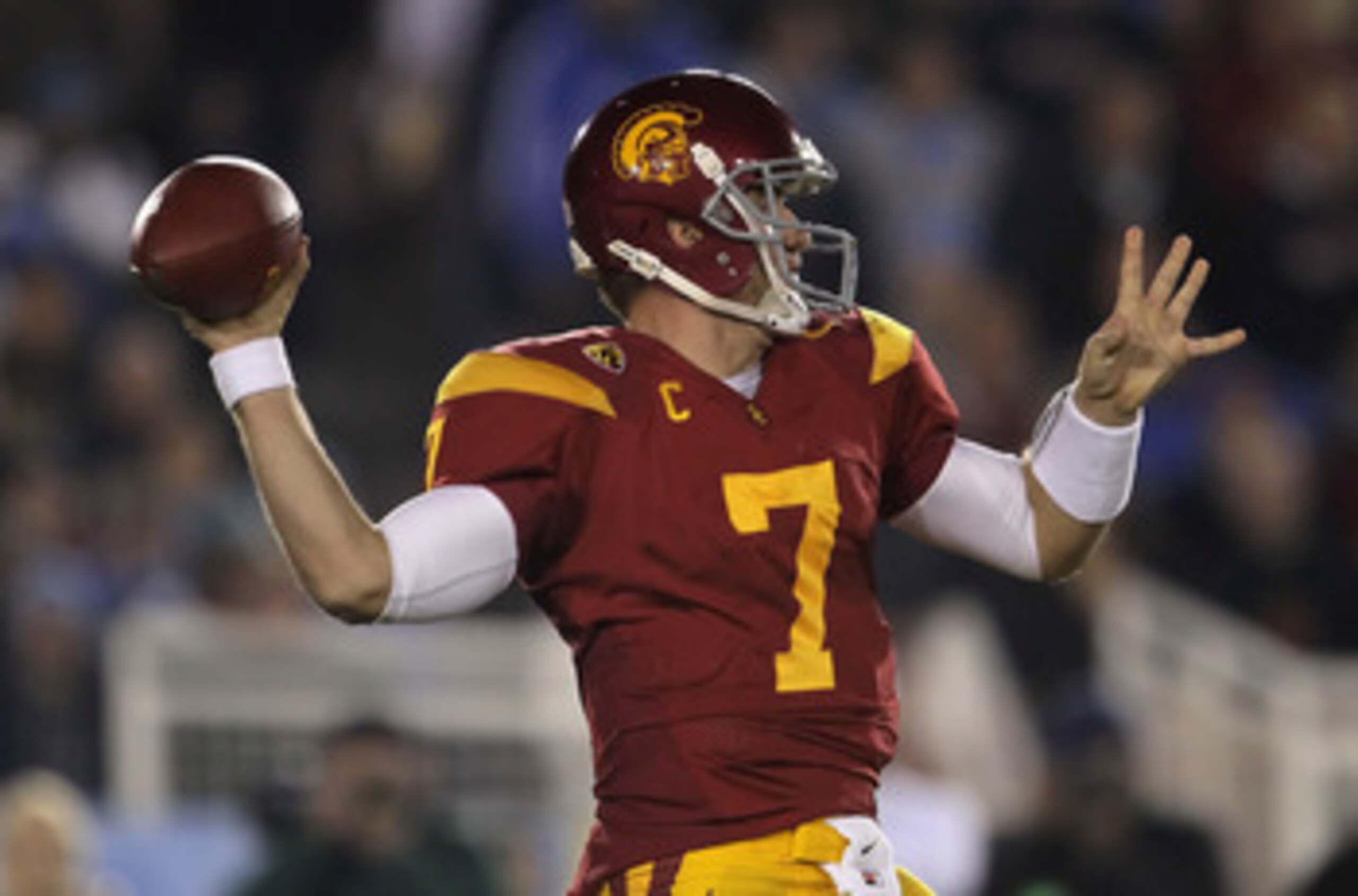 PASADENA, CA - DECEMBER 04:  Quarterback Matt Barkley #7 of the USC Trojans drops back to pass against the UCLA Bruins during the first half at the Rose Bowl on December 4, 2010 in Pasadena, California.  (Photo by Jeff Gross/Getty Images)