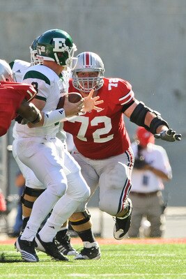 COLUMBUS, OH - SEPTEMBER 25:  Dexter Larimore #72 of the Ohio State Buckeyes chases down quarterback Alex Gillett  #8 of the Eastern Michigan Eagles at Ohio Stadium on September 25, 2010 in Columbus, Ohio.  Ohio State won 73-20. (Photo by Jamie Sabau/Gett