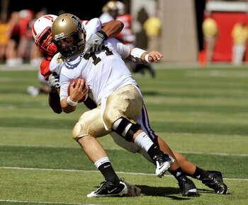 LINCOLN, NEBRASKA - SEPTEMBER 11: Nebraska Cornhuskers defensive tackle Terrence Moore #90 takes down Idaho Vandals quarterback Brian Reader #14 during second half action of their game at Memorial Stadium on September 4, 2010 in Lincoln, Nebraska. Nebrask