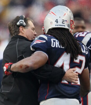 FOXBORO, MA - JANUARY 02:  Head coach Bill Belichick of the New England Patriots congratulates BenJarvus Green-Ellis #42 after Green-Ellis carried for his 1000th career rushing yard in the fourth quarter against the Miami Dolphins on January 2, 2011 at Gi