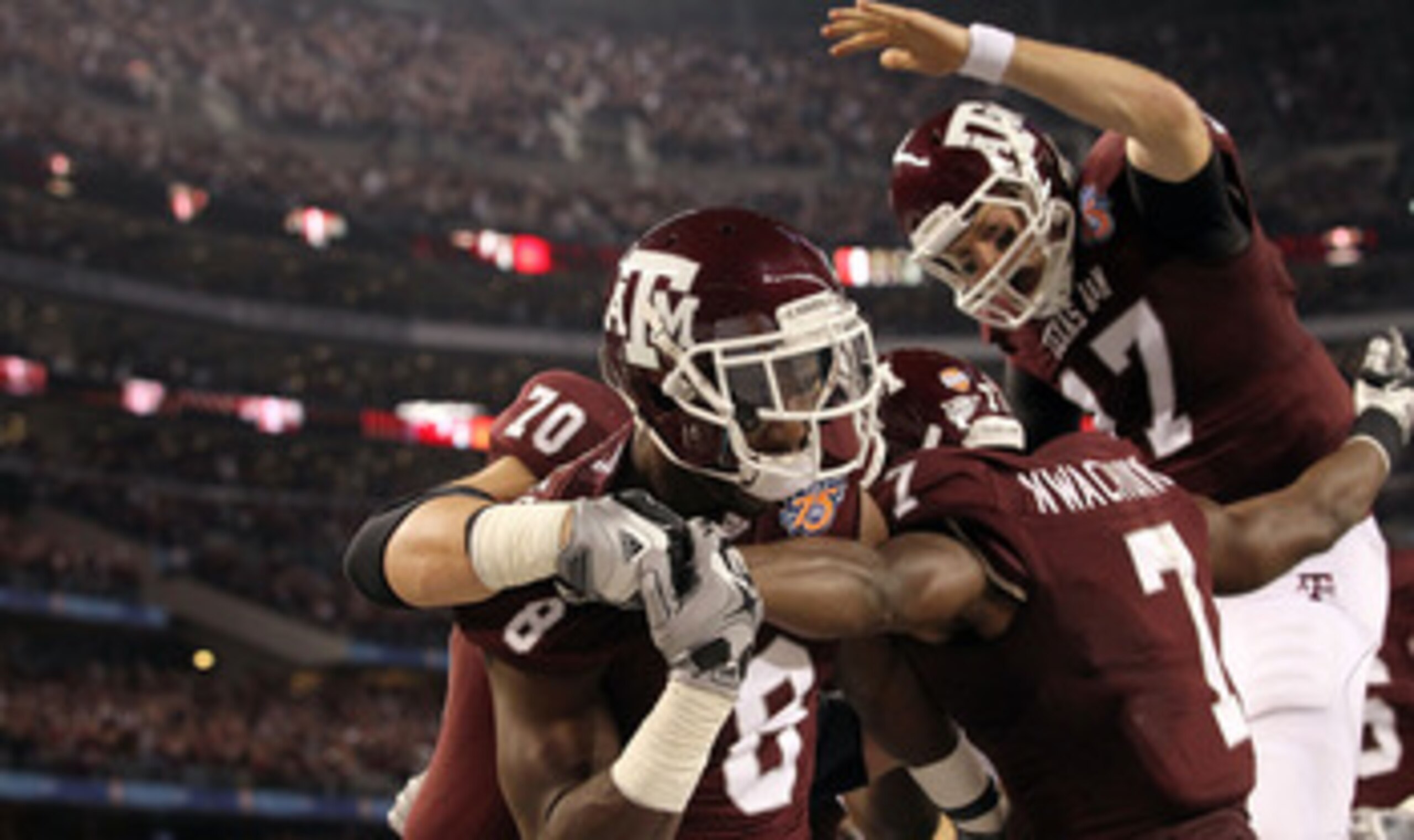 ARLINGTON, TX - JANUARY 07:  Wide receiver Jeff Fuller #8 and Uzoma Nwachukwu #7 of the Texas A&M Aggies celebrate a touchdown against the LSU Tigers during the AT&T Cotton Bowl at Cowboys Stadium on January 7, 2011 in Arlington, Texas.  (Photo by Ronald 