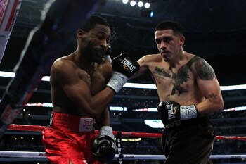 ARLINGTON, TX - NOVEMBER 13:  Brandon Rios (R in brown trunks) lands a punch against Omri Lowther (red trunks) during their Super Lightweight bout at Cowboys Stadium on November 13, 2010 in Arlington, Texas.  (Photo by Nick Laham/Getty Images)
