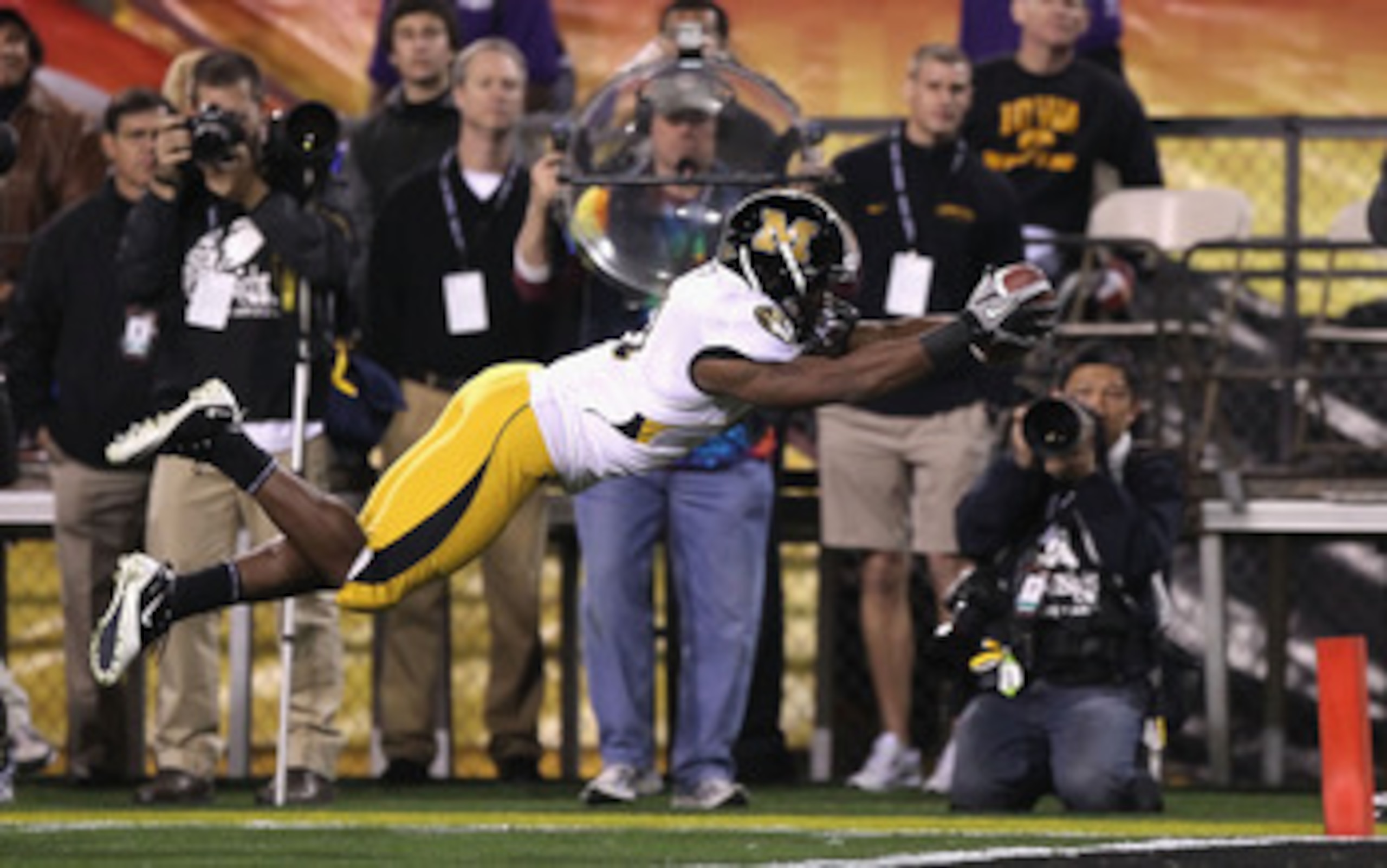 TEMPE, AZ - DECEMBER 28:  Runningback Henry Josey #41 of the Missouri Tigers dives into the endzone to score on a 10 yard rushing touchdown against the Iowa Hawkeyes during the second quarter of the Insight Bowl at Sun Devil Stadium on December 28, 2010 i