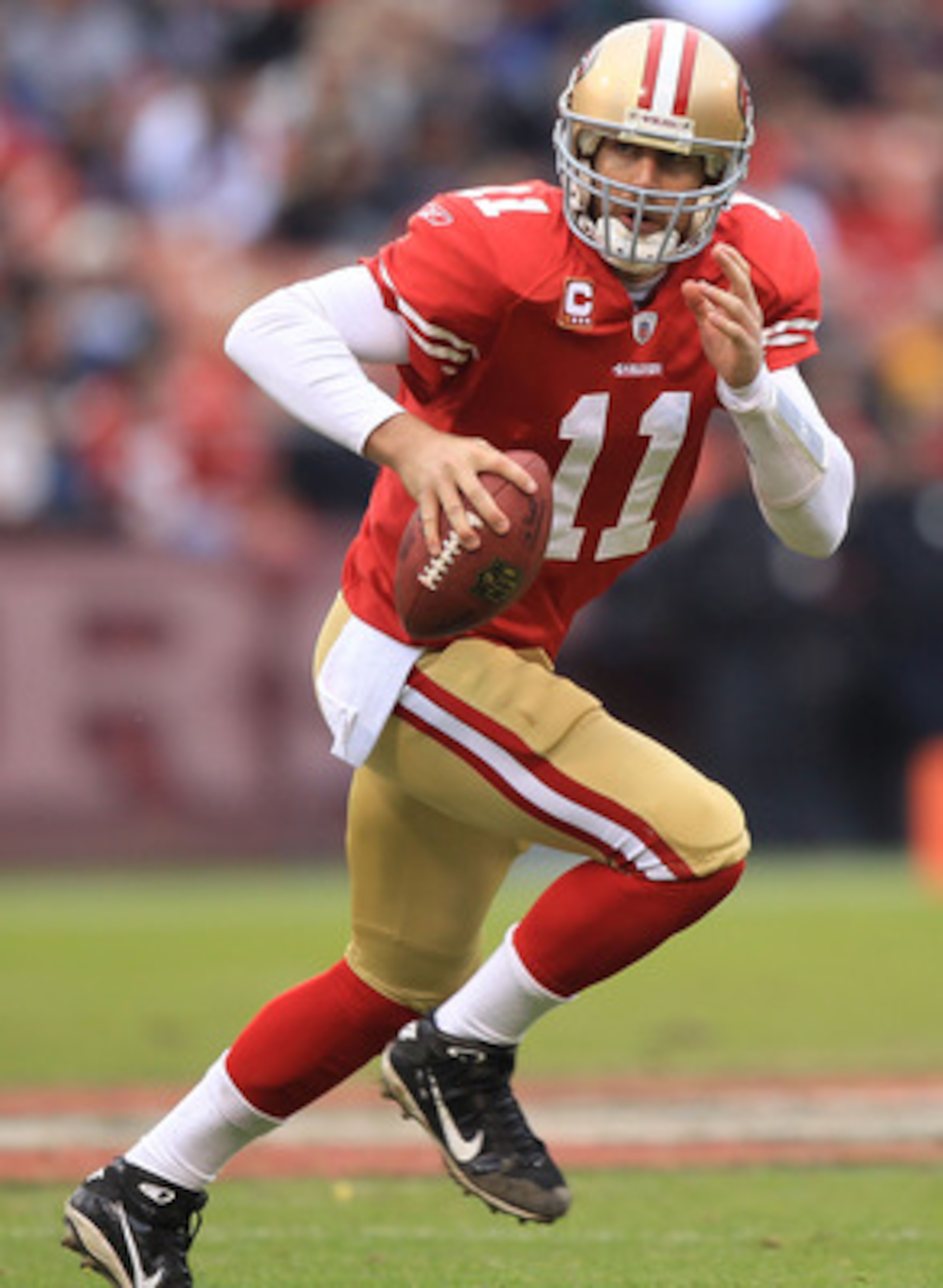 SAN FRANCISCO, CA - JANUARY 02:    Alex Smith #11 of the San Francisco 49ers runs against the Arizona Cardinals during an NFL game at Candlestick Park on January 2, 2011 in San Francisco, California.  (Photo by Jed Jacobsohn/Getty Images)