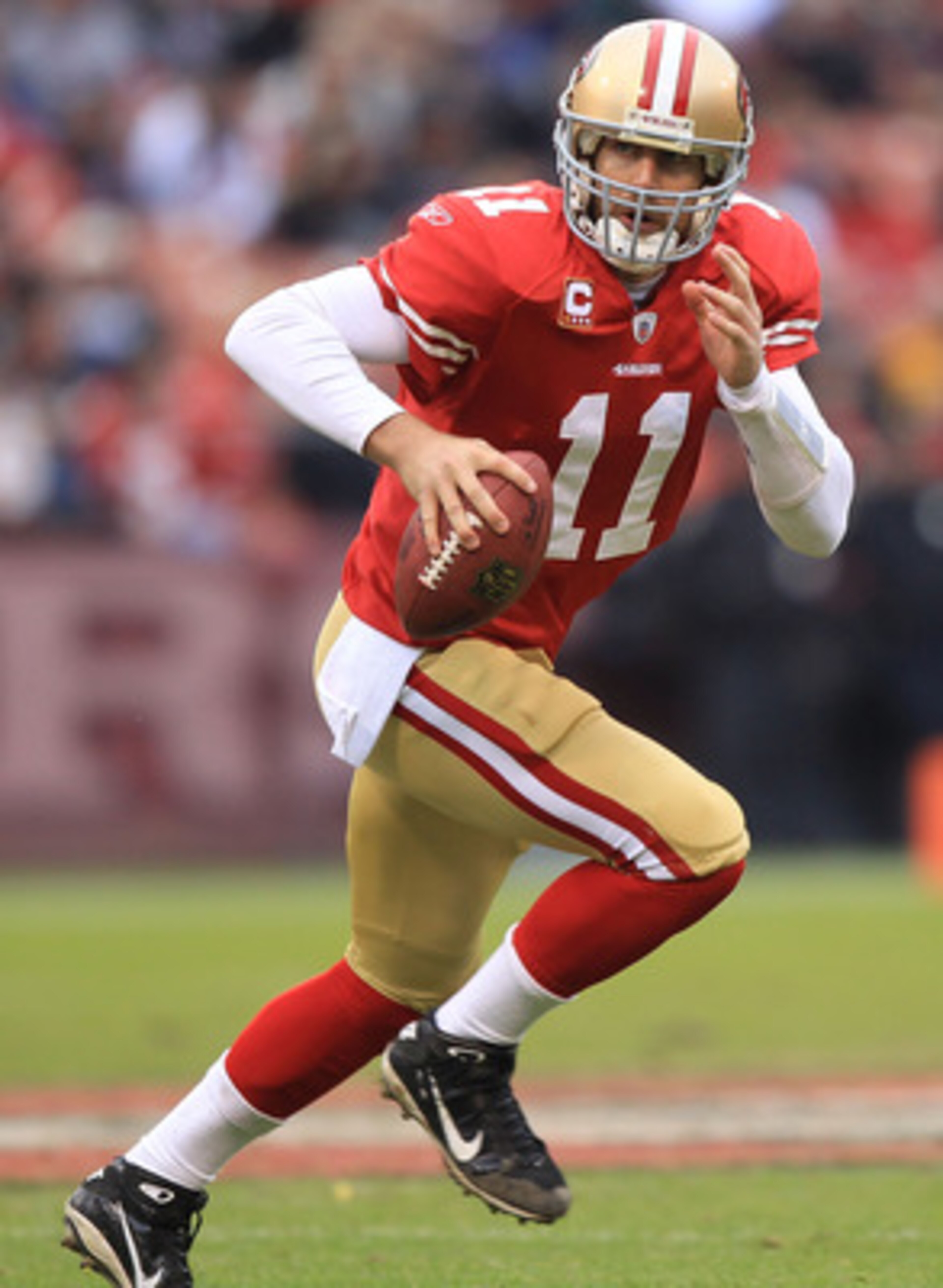 SAN FRANCISCO, CA - JANUARY 02:    Alex Smith #11 of the San Francisco 49ers runs against the Arizona Cardinals during an NFL game at Candlestick Park on January 2, 2011 in San Francisco, California.  (Photo by Jed Jacobsohn/Getty Images)