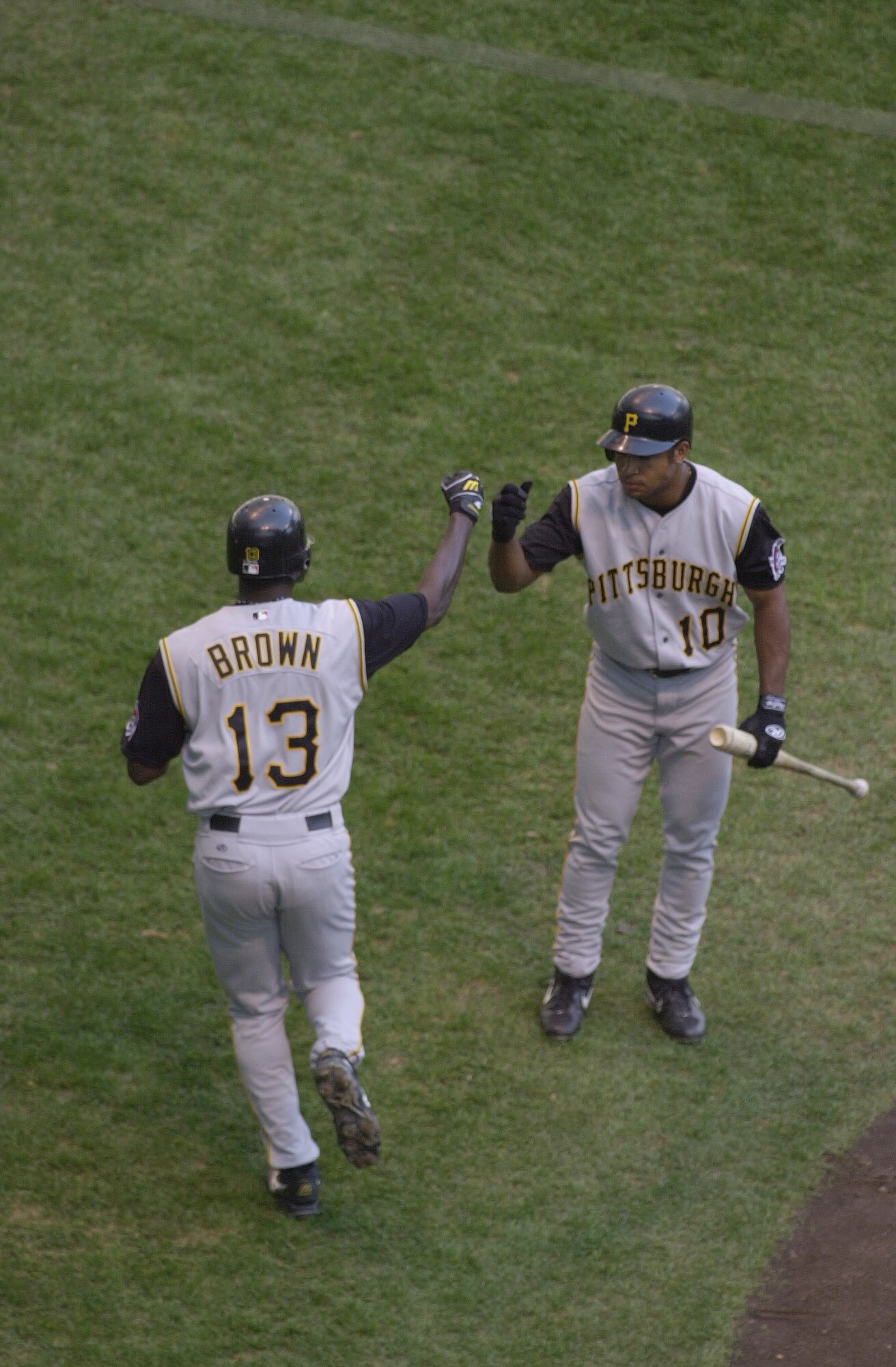 MILWAUKEE-APRIL 17: Abraham Nunez #10 of the Pittsburgh Pirates greets teammate Adrian Brown #13 during the game against  the Milwaukee Brewers at Miller Park in Milwaukee, Wisconsin on April 17,2002. The Pirates won 3-2.  Mandatory Credit: Jonathan Danie