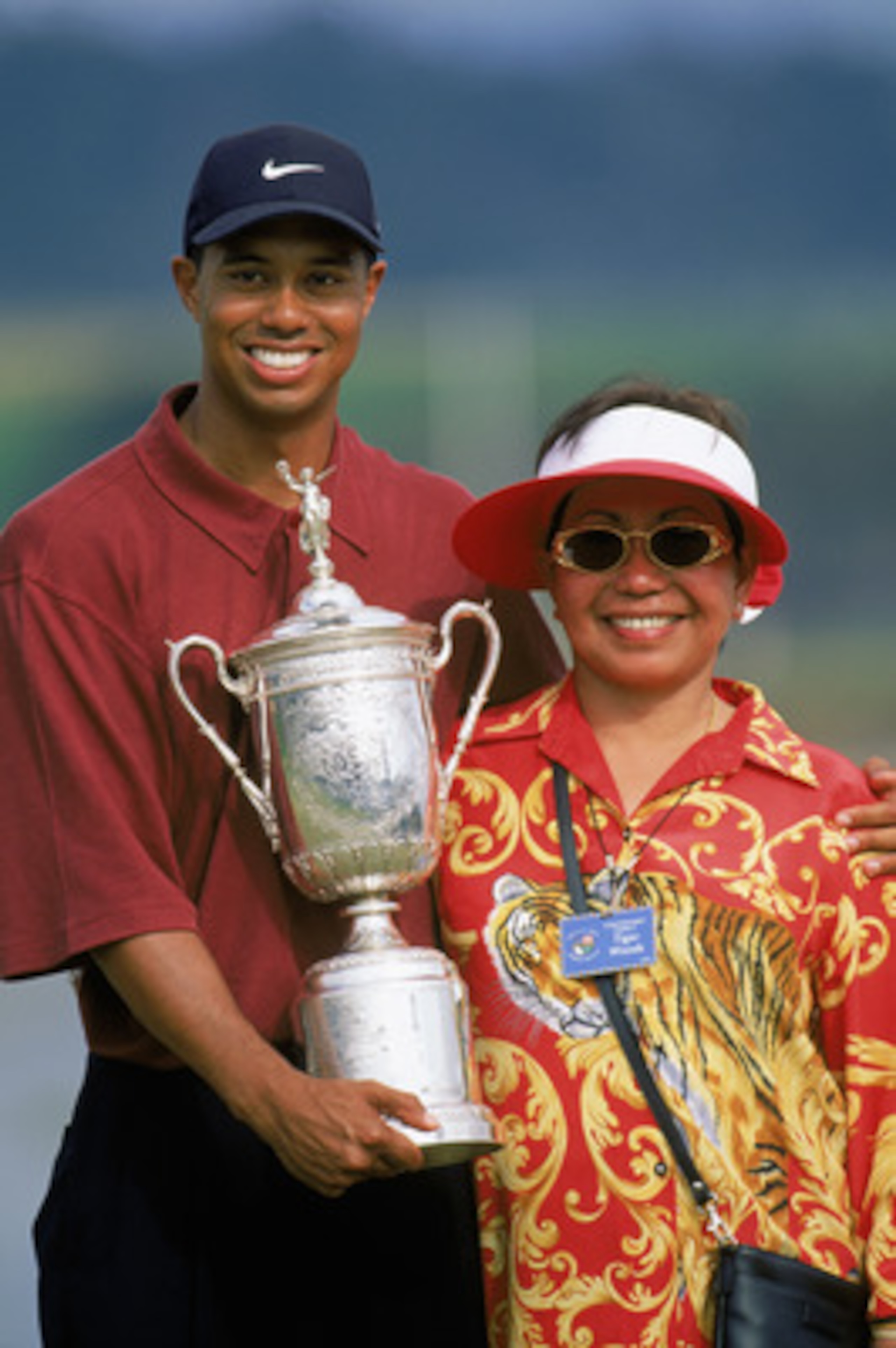 PEBBLE BEACH, CA - JUNE 18: Tiger Woods holds the trophy as he poses with his mother Kultida Woods after winning the 100th US Open at the Pebble Beach Golf Links on June 18, 2000 in Pebble Beach, California. (Photo by Jamie Squire/Getty Images) PEBBLE BEACH, CA - JUNE 18: Tiger Woods holds the trophy as he poses with his mother Kultida Woods after winning the 100th US Open at the Pebble Beach Golf Links on June 18, 2000 in Pebble Beach, California. (Photo by Jamie Squire/Getty Images)