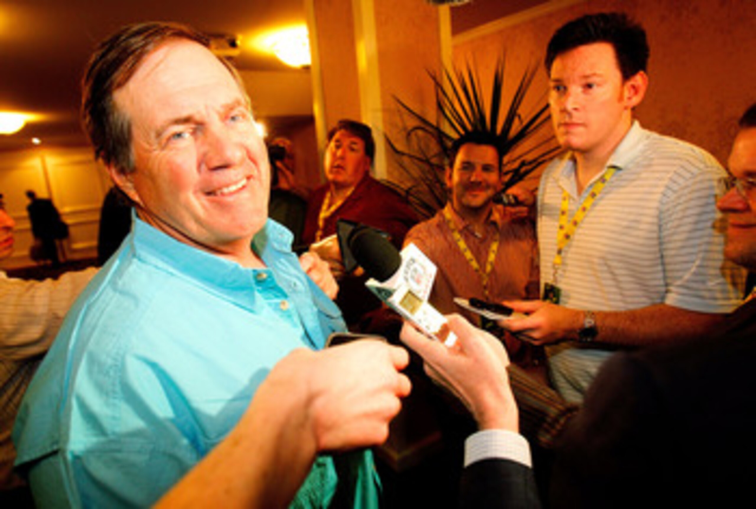 NEW ORLEANS, LA - MARCH 21: New England Patriot head coach Bill Belichick jokes with the media after missing breakfast during the NFL Annual Meetings at the Roosevelt Hotel on March 21, 2011 in New Orleans, Louisiana. Despite a NFL owners imposed lockout