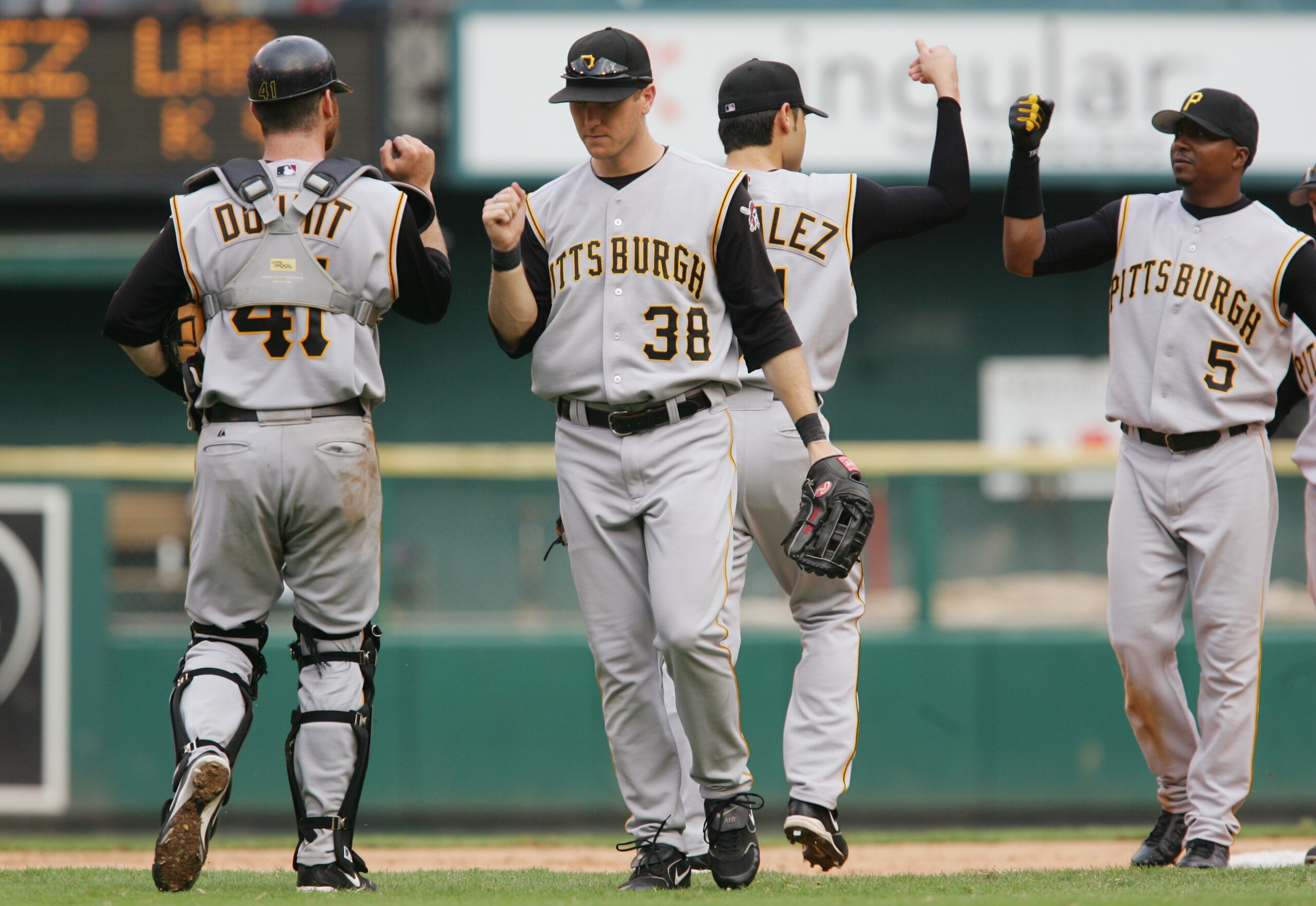 ST. LOUIS - SEPTEMBER 14:  Jason Bay #38, Ryan Doumit #41, Tike Redman #5 and Mike Gonzalez #51 of the Pittsburgh Pirates high five each other as they celebrate against the St. Louis Cardinals during the MLB game on September 14, 2005 at Busch Stadium in