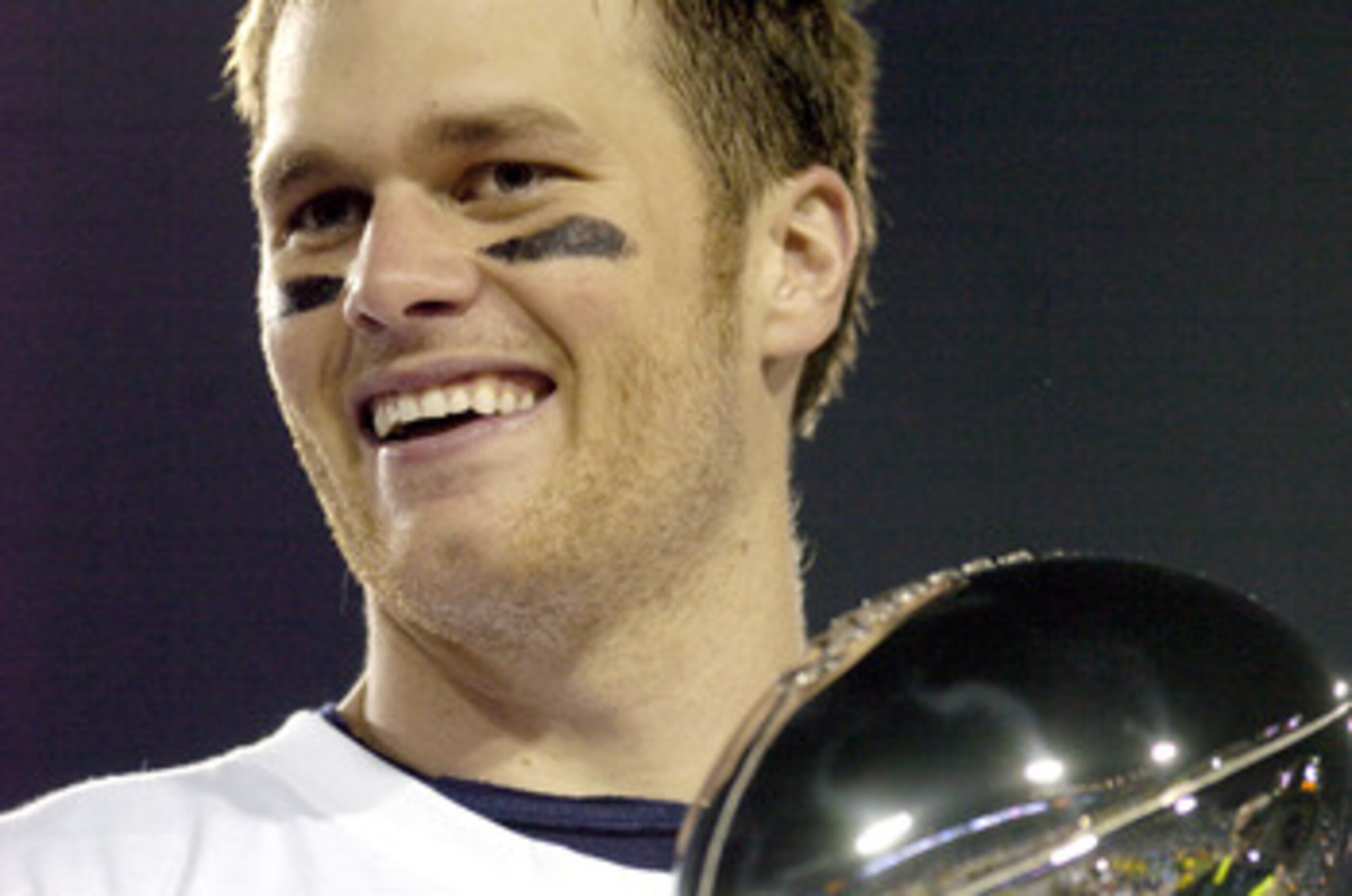 Tom Brady holds the Vince Lombardi Trophy as he stands on the podium after The New England Patriots defeated The Philadelphia Eagles in Super Bowl XXXIX at Alltel Staduim in Jacksonville, Florida. (Photo by Al Messerschmidt/Getty Images) Tom Brady holds the Vince Lombardi Trophy as he stands on the podium after The New England Patriots defeated The Philadelphia Eagles in Super Bowl XXXIX at Alltel Staduim in Jacksonville, Florida. (Photo by Al Messerschmidt/Getty Images)