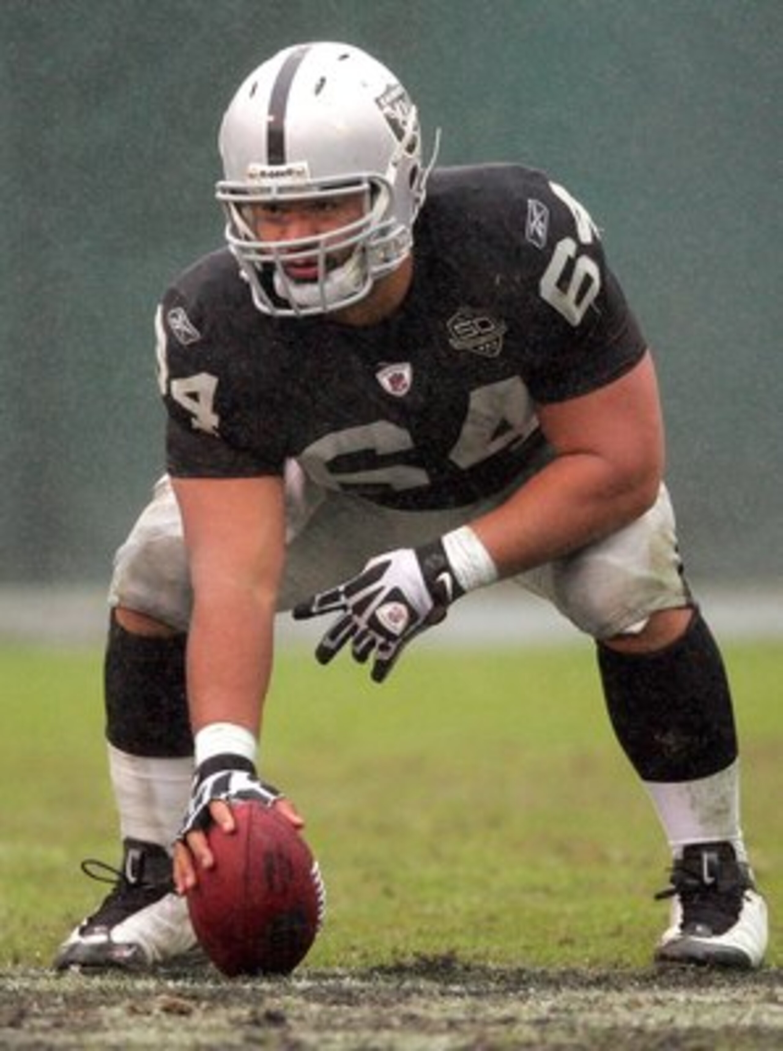 OAKLAND, CA - DECEMBER 13: Samson Satele #64 of the Oakland Raiders gets set to snap the ball during their game against the Washington Redskins at Oakland-Alameda County Coliseum on December 13, 2009 in Oakland, California.  (Photo by Ezra Shaw/Getty Imag