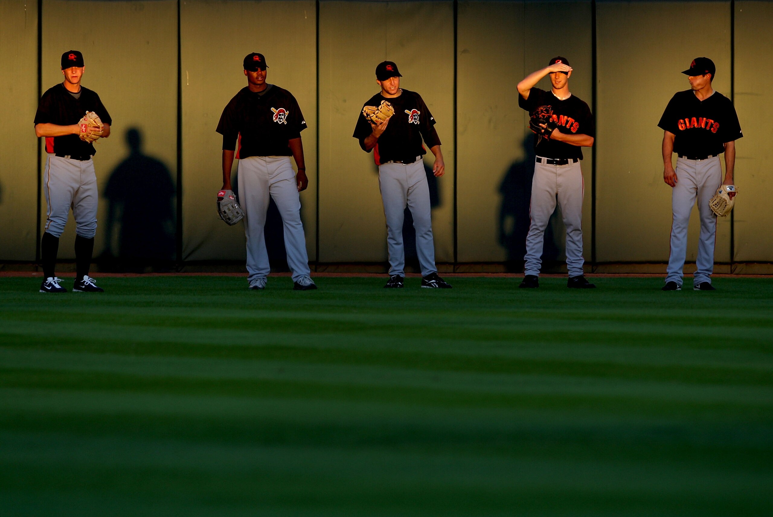 PHOENIX - OCTOBER 16:  (L-R) Pittsburgh Pirates prospects; Tony Watson #13, Donnie Veal #56, Danny Moskos #41, San Francisco Giants prospects; Steve Edlefsen #60 and Joe Martinez #49 all playing for the Scottsdale Scorpions warm up in the outfield before