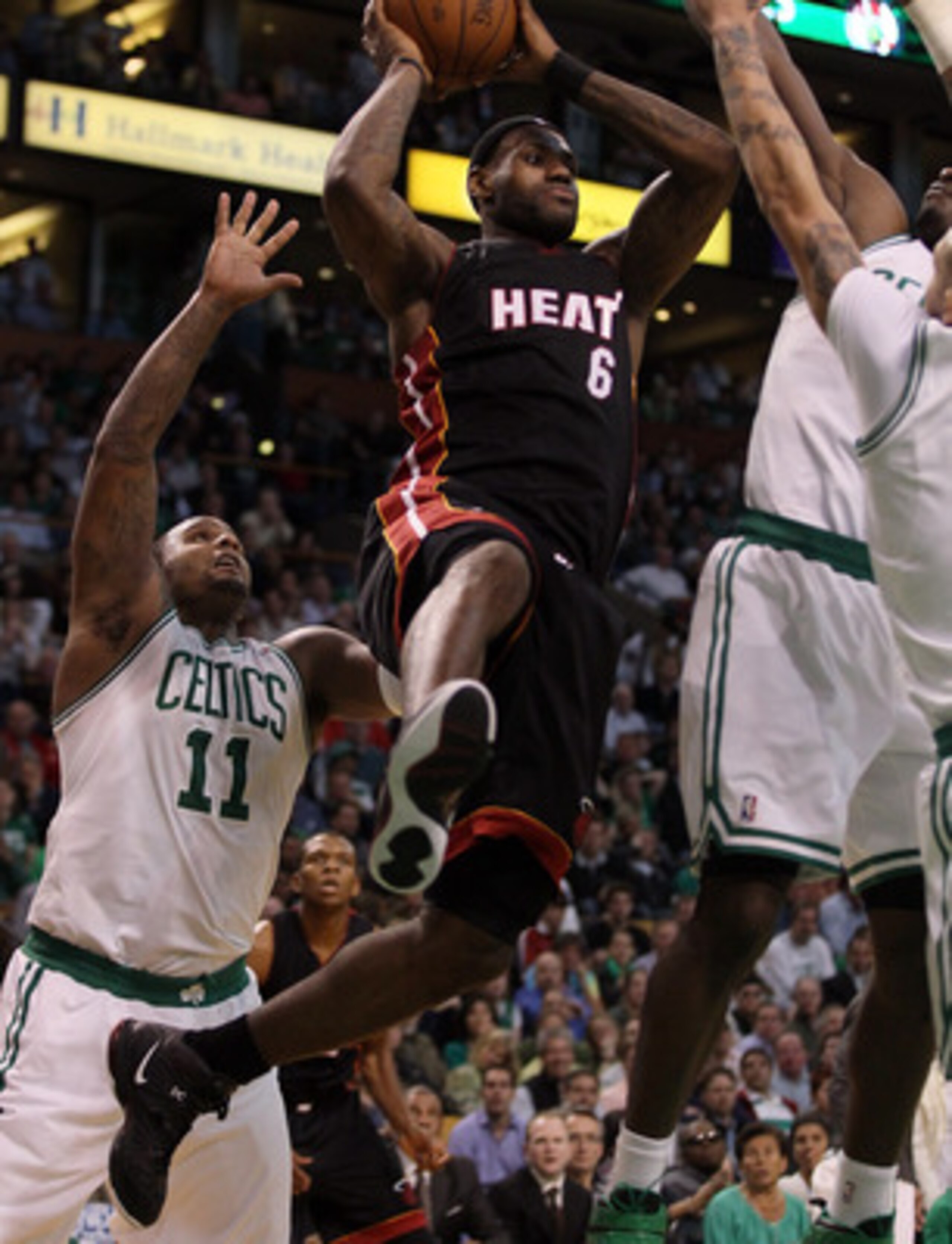 BOSTON, MA - MAY 09:  LeBron James #6 of the Miami Heat tries to pass the ball as Glen Davis #11 and Delonte West #13 of the Boston Celtics defend in Game Four of the Eastern Conference Semifinals in the 2011 NBA Playoffs on May 9, 2011 at the TD Garden i