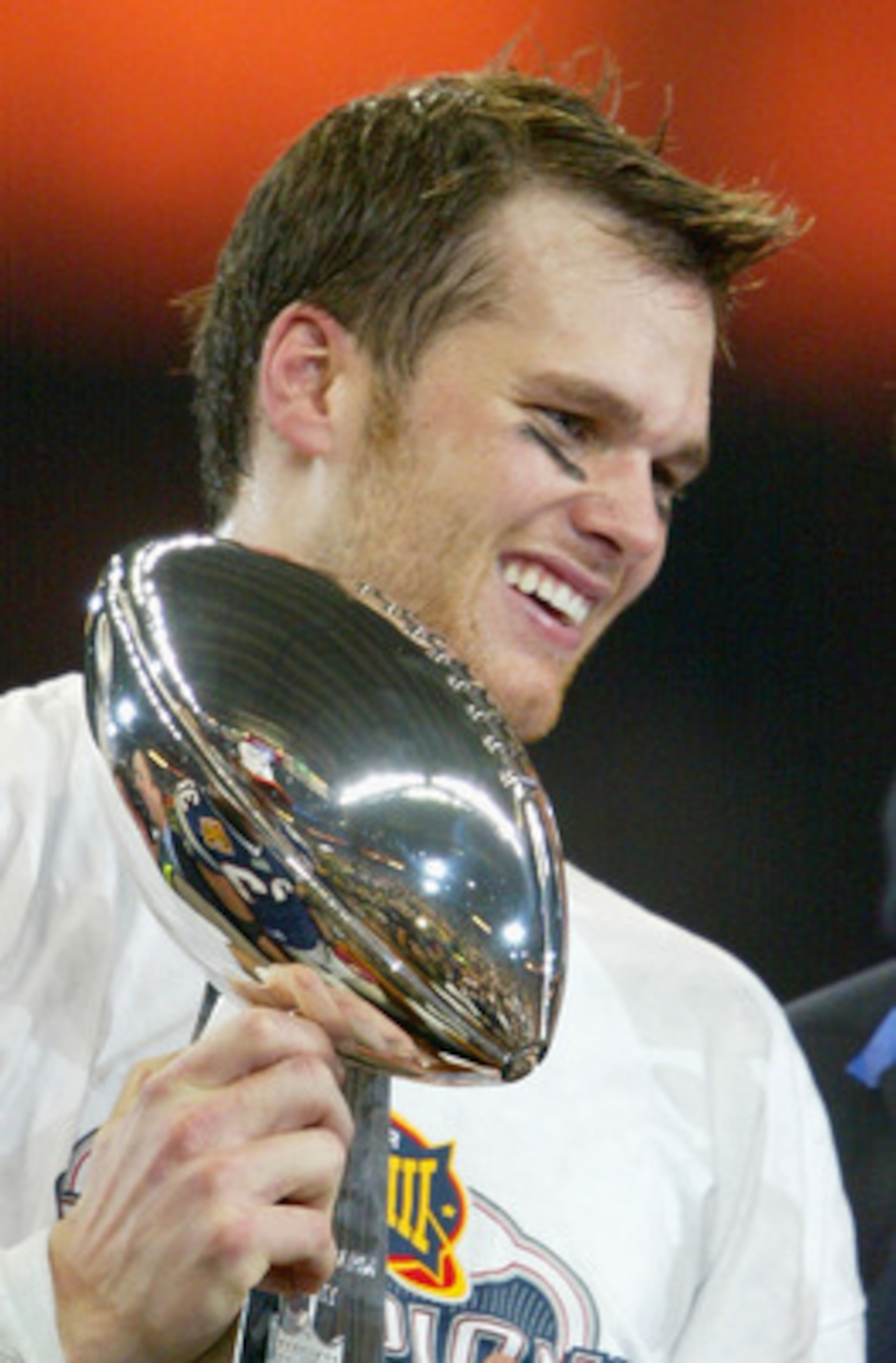 HOUSTON, TX - FEBRUARY 1: MVP Tom Brady #12 of the New England Patriots holds the Lombardi trophy after defeating the Carolina Panthers 32-29 in Super Bowl XXXVIII at Reliant Stadium on February 1, 2004 in Houston, Texas. (Photo by Andy Lyons/Getty Image HOUSTON, TX - FEBRUARY 1: MVP Tom Brady #12 of the New England Patriots holds the Lombardi trophy after defeating the Carolina Panthers 32-29 in Super Bowl XXXVIII at Reliant Stadium on February 1, 2004 in Houston, Texas. (Photo by Andy Lyons/Getty Image
