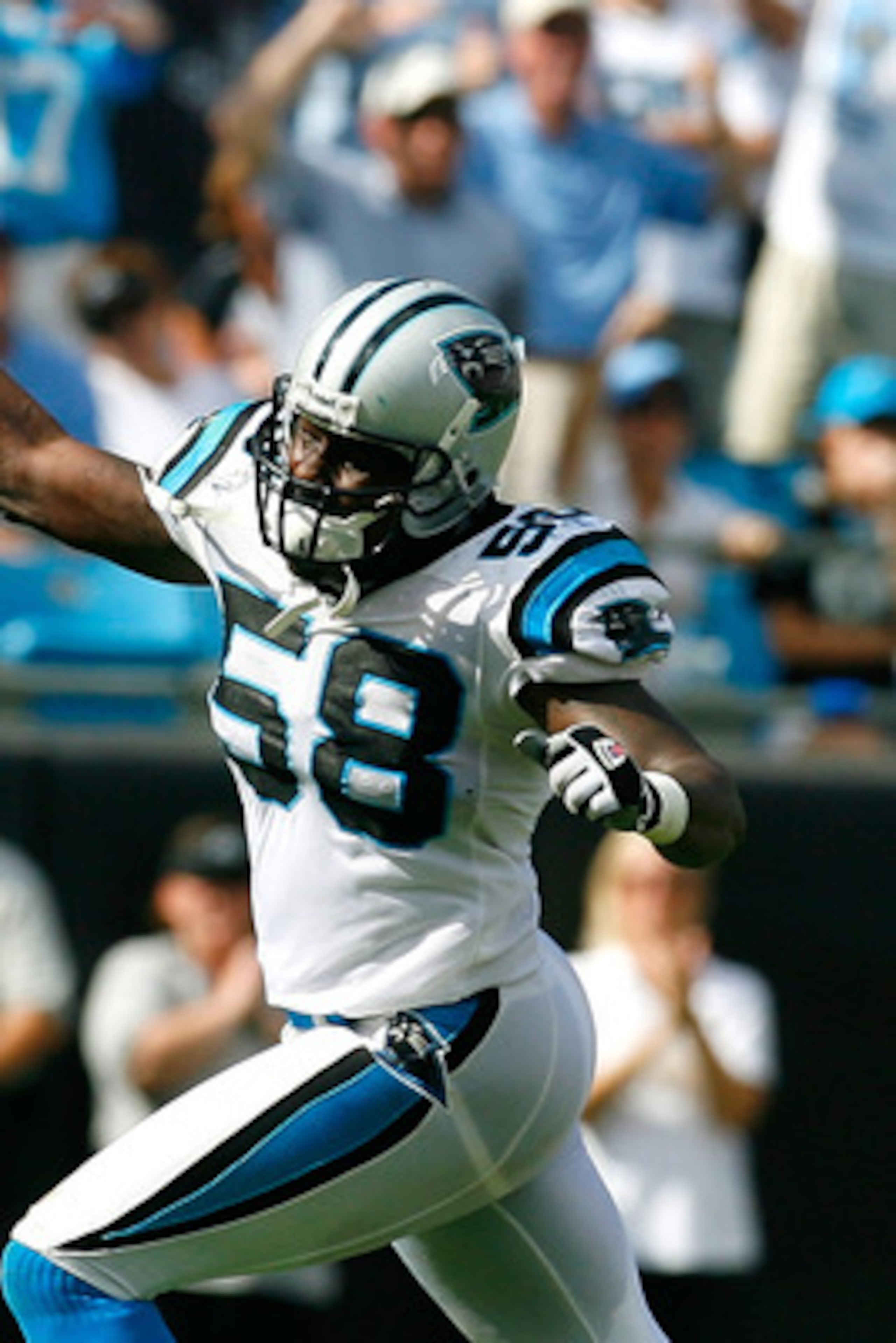 CHARLOTTE, NC - SEPTEMBER 14: Linebacker Thomas Davis #58 of the Carolina Panthers celebrates a fourth down stop in the final minutes of their 20-17 win over the Chicago Bears at Bank of America Stadium on September 14, 2008 in Charlotte, North Carolina. CHARLOTTE, NC - SEPTEMBER 14: Linebacker Thomas Davis #58 of the Carolina Panthers celebrates a fourth down stop in the final minutes of their 20-17 win over the Chicago Bears at Bank of America Stadium on September 14, 2008 in Charlotte, North Carolina.