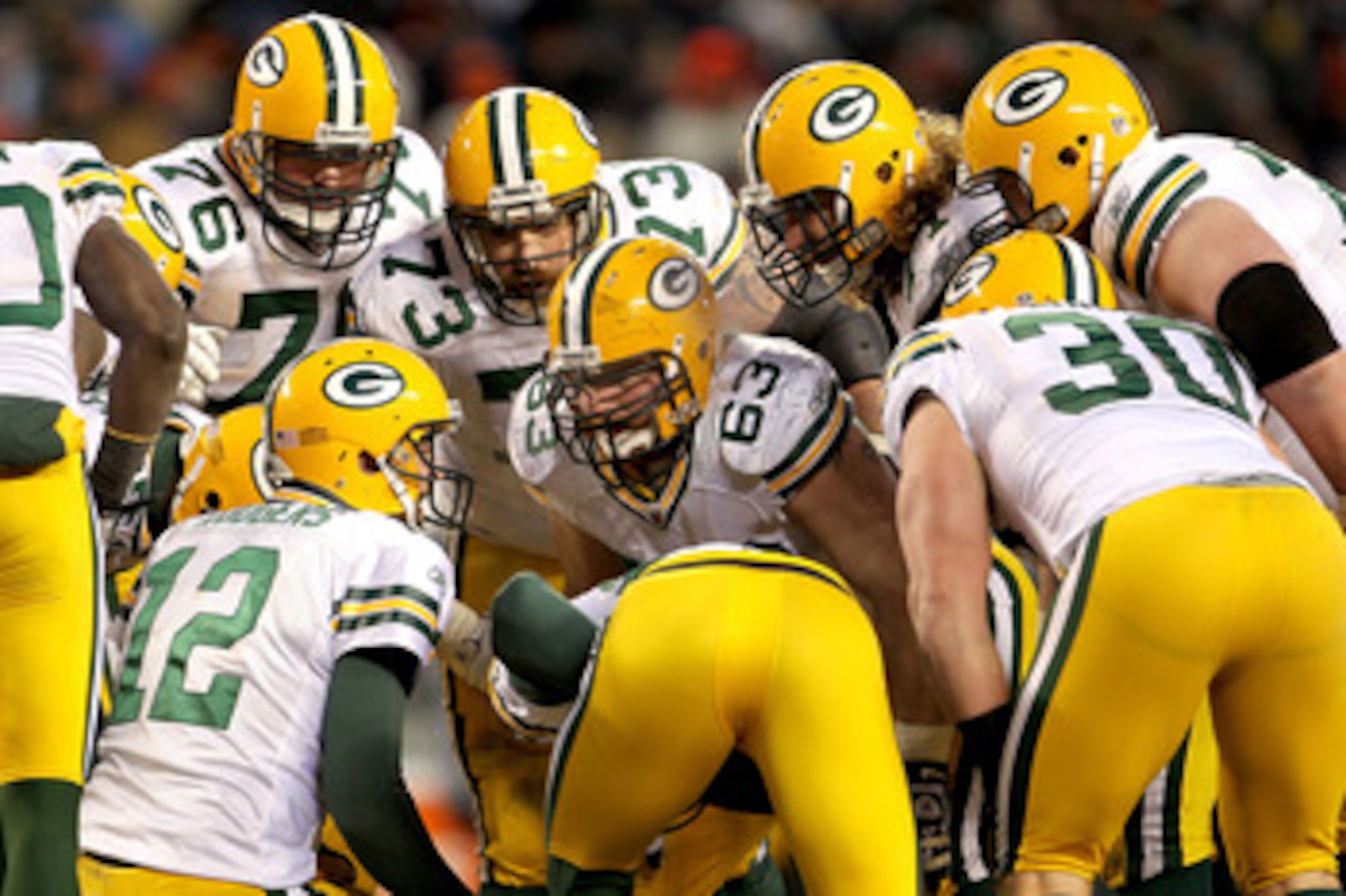 CHICAGO, IL - JANUARY 23:  Aaron Rodgers #12 of the Green Bay Packers huddles with his teammates against the Chicago Bears in the NFC Championship Game at Soldier Field on January 23, 2011 in Chicago, Illinois.  (Photo by Jamie Squire/Getty Images)