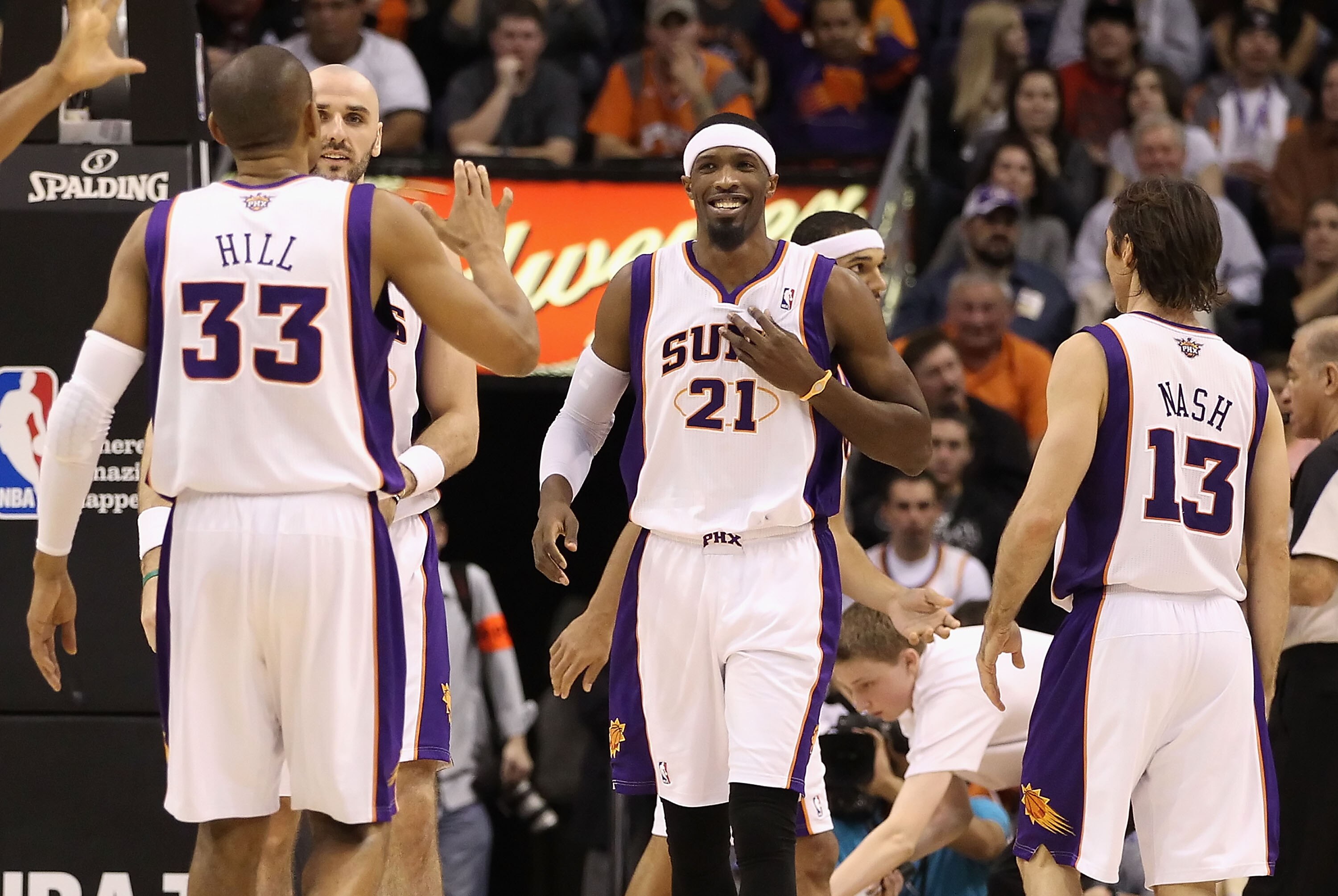 PHOENIX, AZ - JANUARY 14:  Hakim Warrick #21 of the Phoenix Suns celebrates with teammates Grant Hill #33 and Steve Nash #13 after scoring against the Portland Trail Blazers during the NBA game at US Airways Center on January 14, 2011 in Phoenix, Arizona.