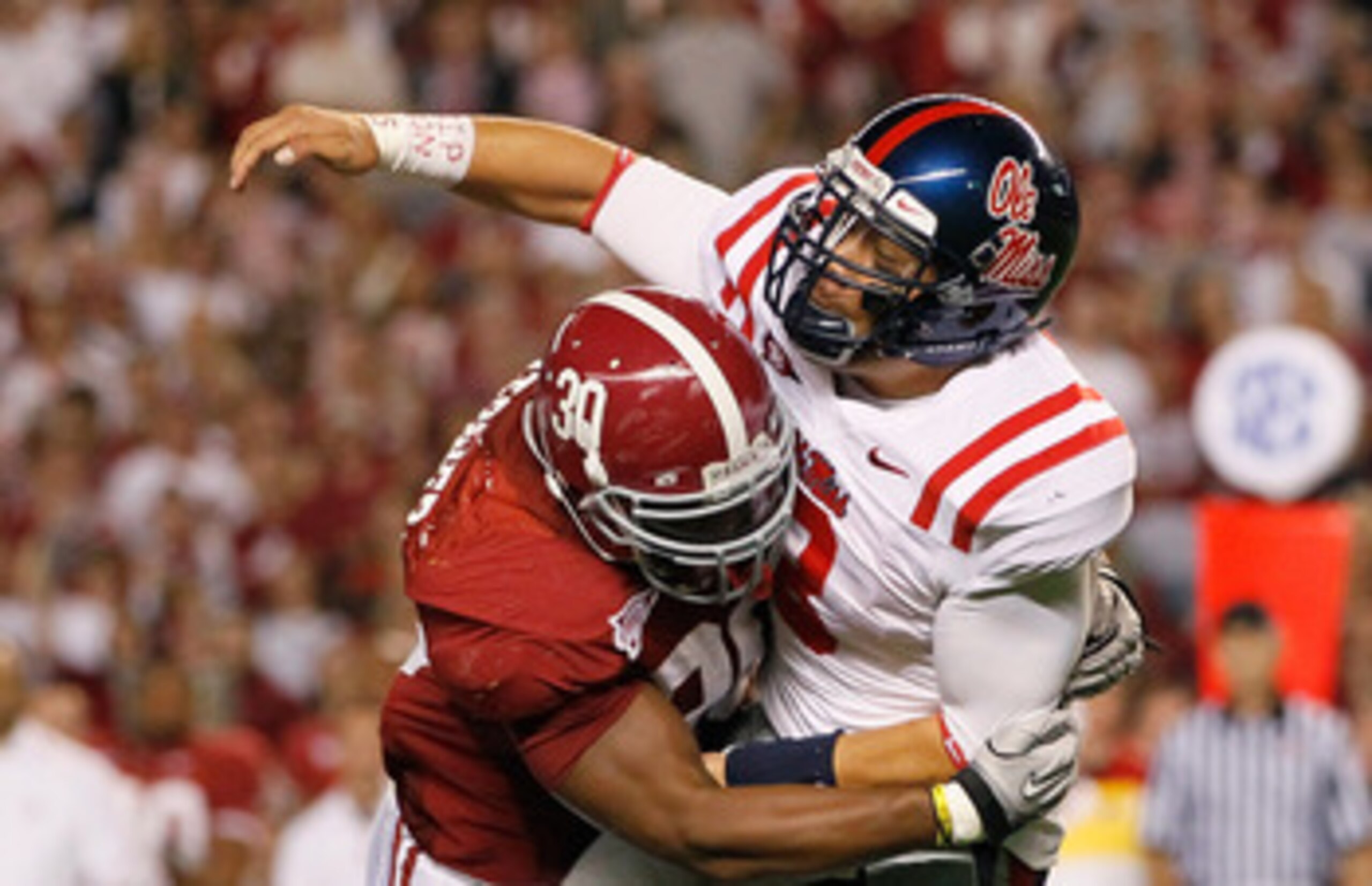 TUSCALOOSA, AL - OCTOBER 16:  Dont'a Hightower #30 of the Alabama Crimson Tide pressures quarterback Jeremiah Masoli #8 of the Ole Miss Rebels at Bryant-Denny Stadium on October 16, 2010 in Tuscaloosa, Alabama.  (Photo by Kevin C. Cox/Getty Images)