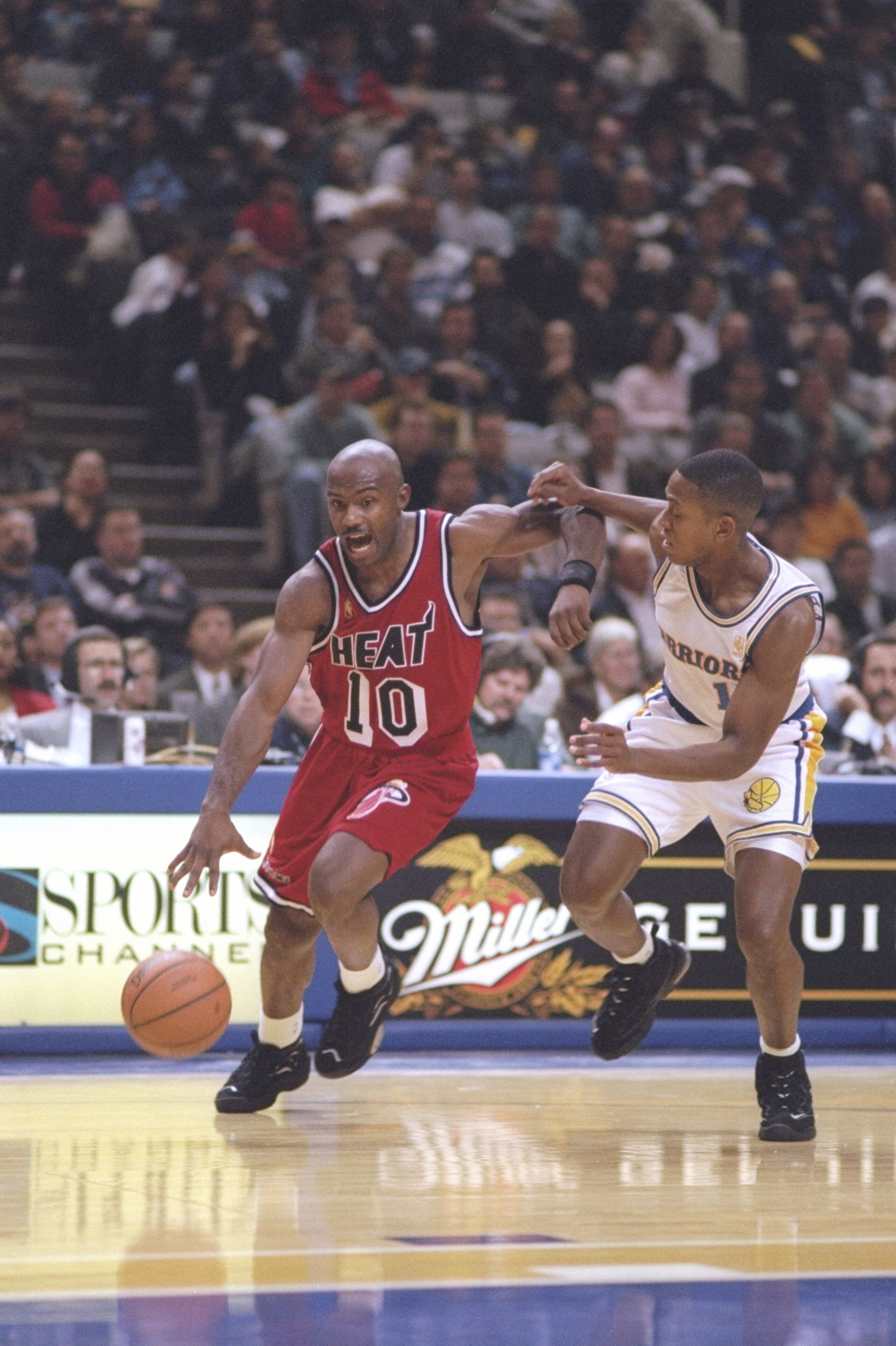 26 Nov 1996:  Guard Tim Hardaway of the Miami Heat drives past guard B.J. Armstrong of the Golden State Warriors at the San Jose Arena in San Jose, California.  The Heat won the game 107-88. Mandatory Credit: Otto Greule  /Allsport