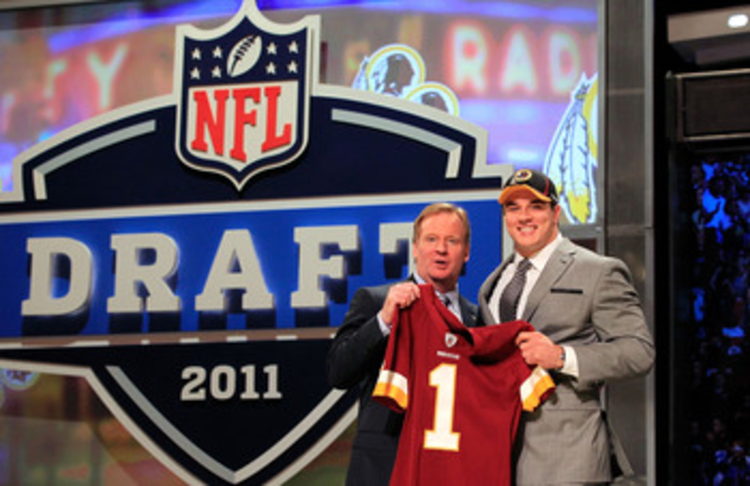NEW YORK, NY - APRIL 28:  NFL Commissioner Roger Goodell (L) poses for a photo with Ryan Kerrigan, #16 overall pick by the Washington Redskins, on stage during the 2011 NFL Draft at Radio City Music Hall on April 28, 2011 in New York City.  (Photo by Chri