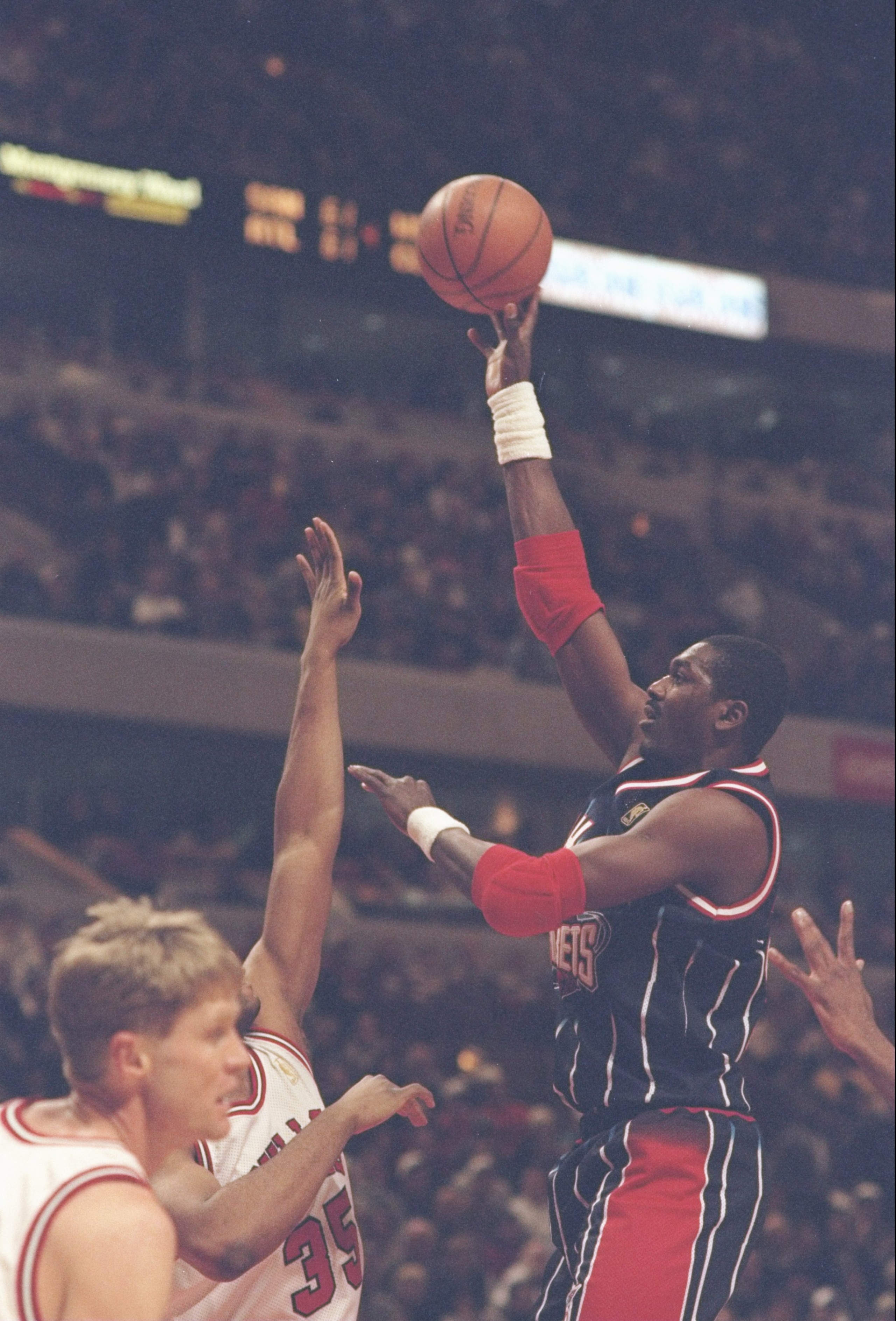 11 Jan 1997:  Center Hakeem Olajuwon of the Houston Rockets goes up for two against forward Jason Caffey of the Chicago Bulls during a game at the United Center in Chicago, Illinois.  The Bulls won the game 110-86.. Mandatory Credit: Jonathan Daniel  /All