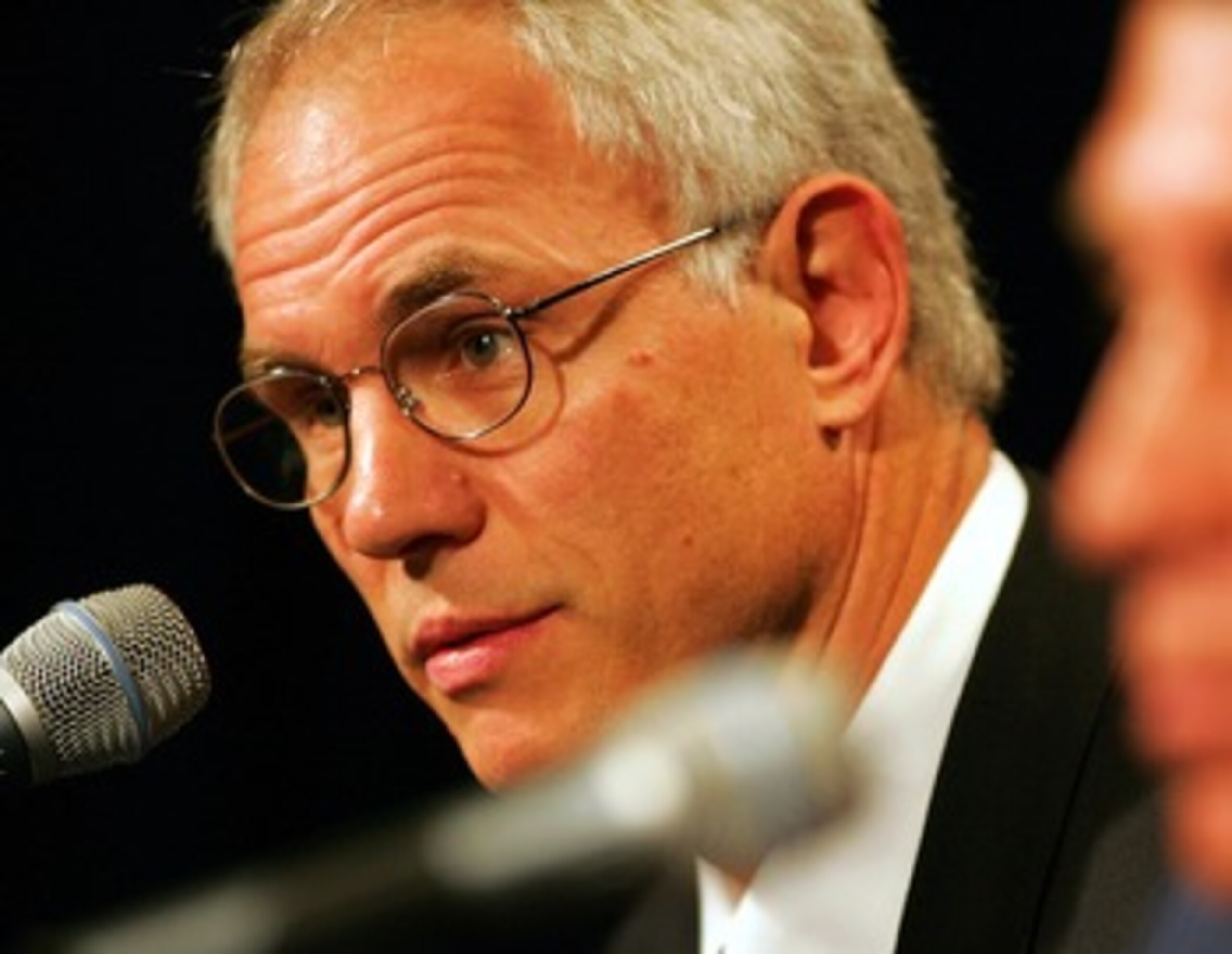 LOS ANGELES - JULY 10:  Mitch Kupchak, general manager of the Los Angeles Lakers takes questions from the the media during a press conference announcing Rudy Tomjanovich as the new head coach on July 10, 2004 at the Staples Center in Los Angeles, Californ