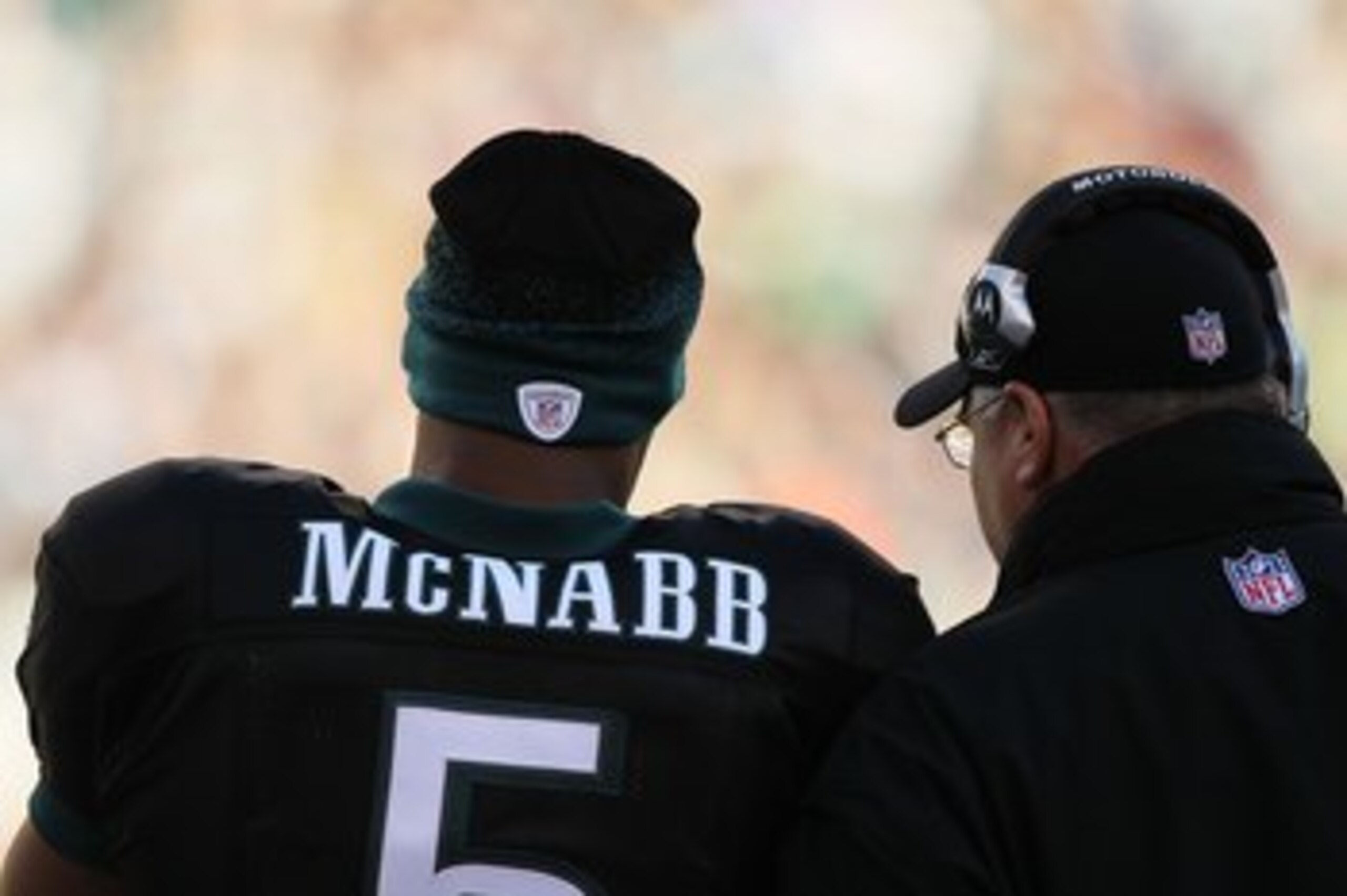 PHILADELPHIA - NOVEMBER 29:  Donovan McNabb #5 of the Philadelphia Eagles stands with Head Coach Andy Reid from the sidelines against the Washington Redskins during their game at Lincoln Financial Field on November 29, 2009 in Philadelphia, Pennsylvania.