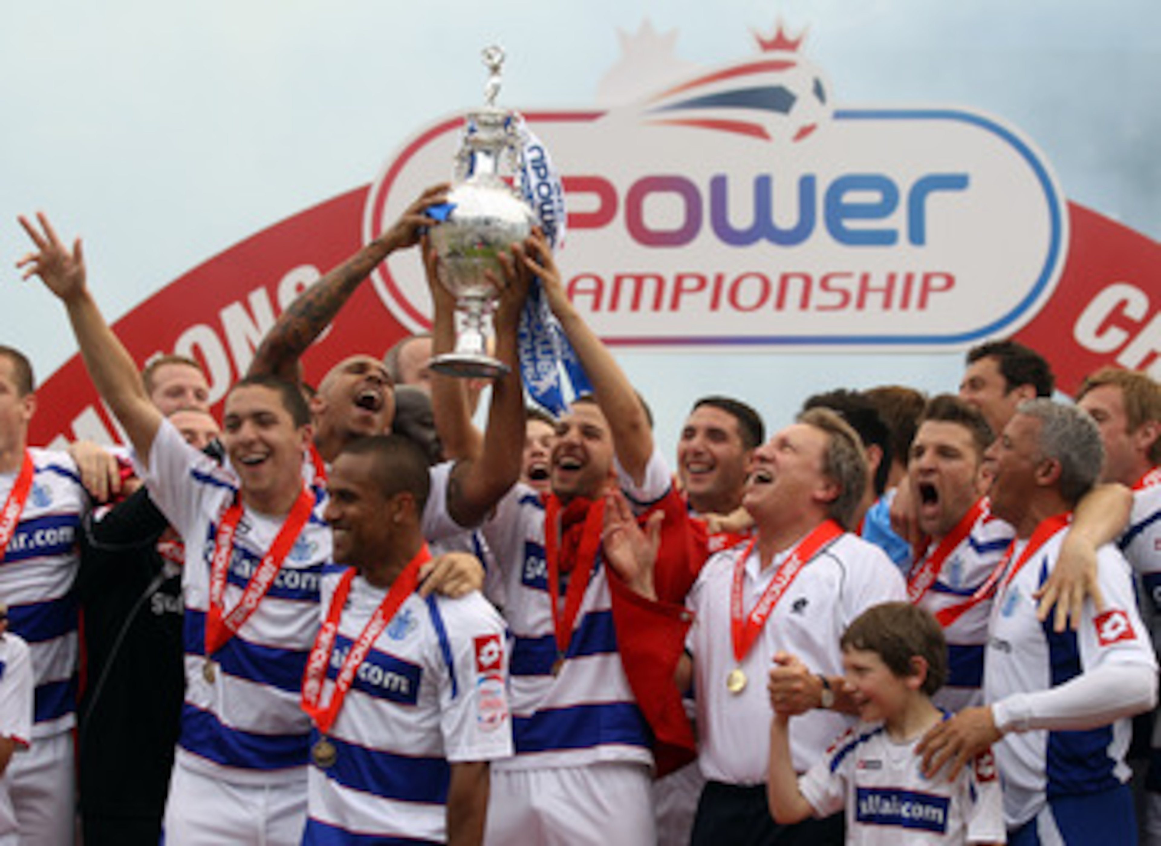 LONDON, ENGLAND - MAY 07: Queens Park Rangers players celebrates with the trophy after winning the npower Championship match between Queens Park Rangers and Leeds United at Loftus Road on May 7, 2011 in London, England. (Photo by Ian Walton/Getty Images LONDON, ENGLAND - MAY 07: Queens Park Rangers players celebrates with the trophy after winning the npower Championship match between Queens Park Rangers and Leeds United at Loftus Road on May 7, 2011 in London, England. (Photo by Ian Walton/Getty Images