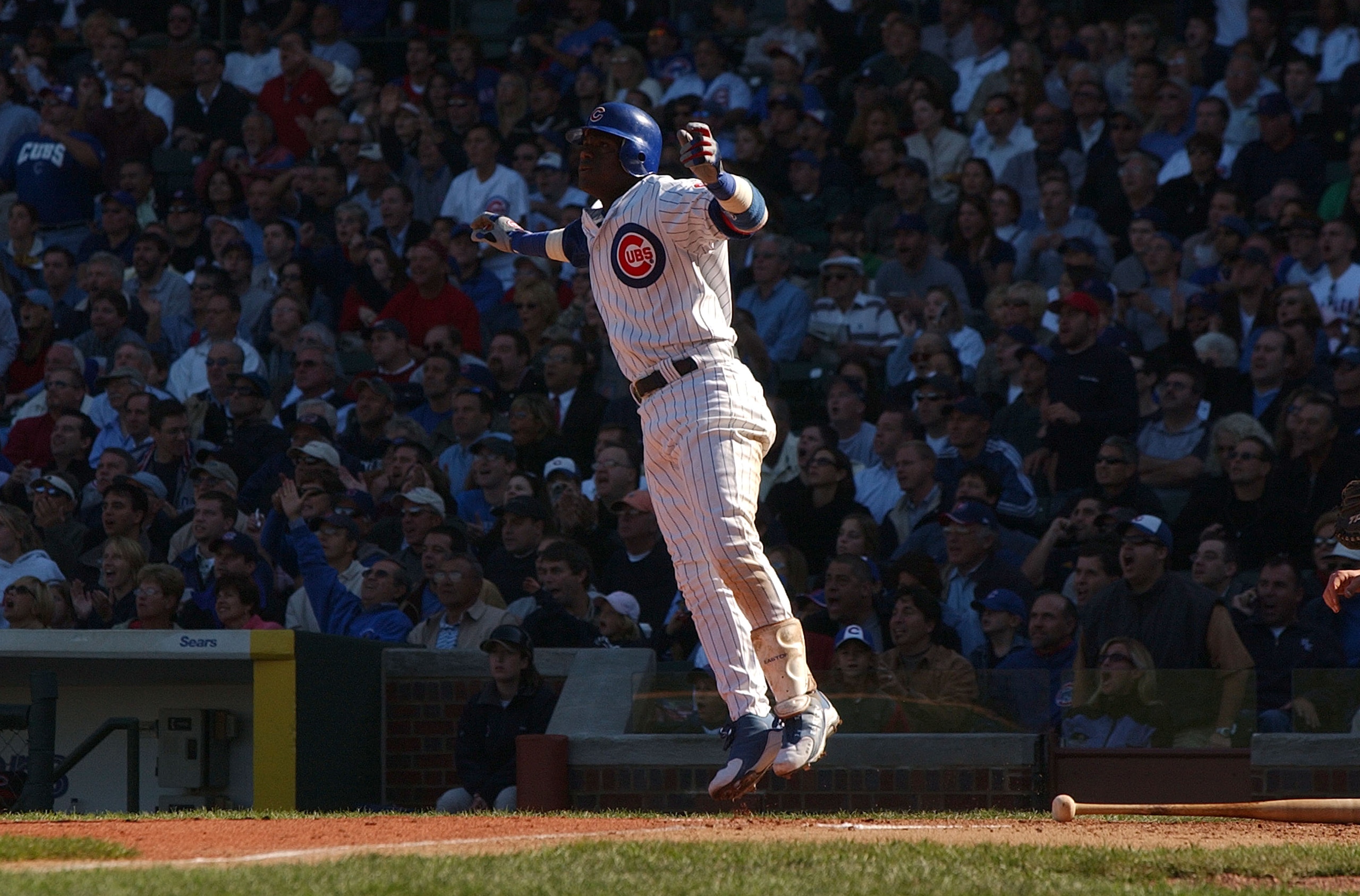 CHICAGO - SEPTEMBER 30:  Sammy Sosa #21 of the Chicago Cubs hops after hitting a solo home run in the sixth inning against the Cincinnati Reds during a game on September 30, 2004 at Wrigley Field in Chicago, Illinois. (Photo by Jonathan Daniel/Getty Image