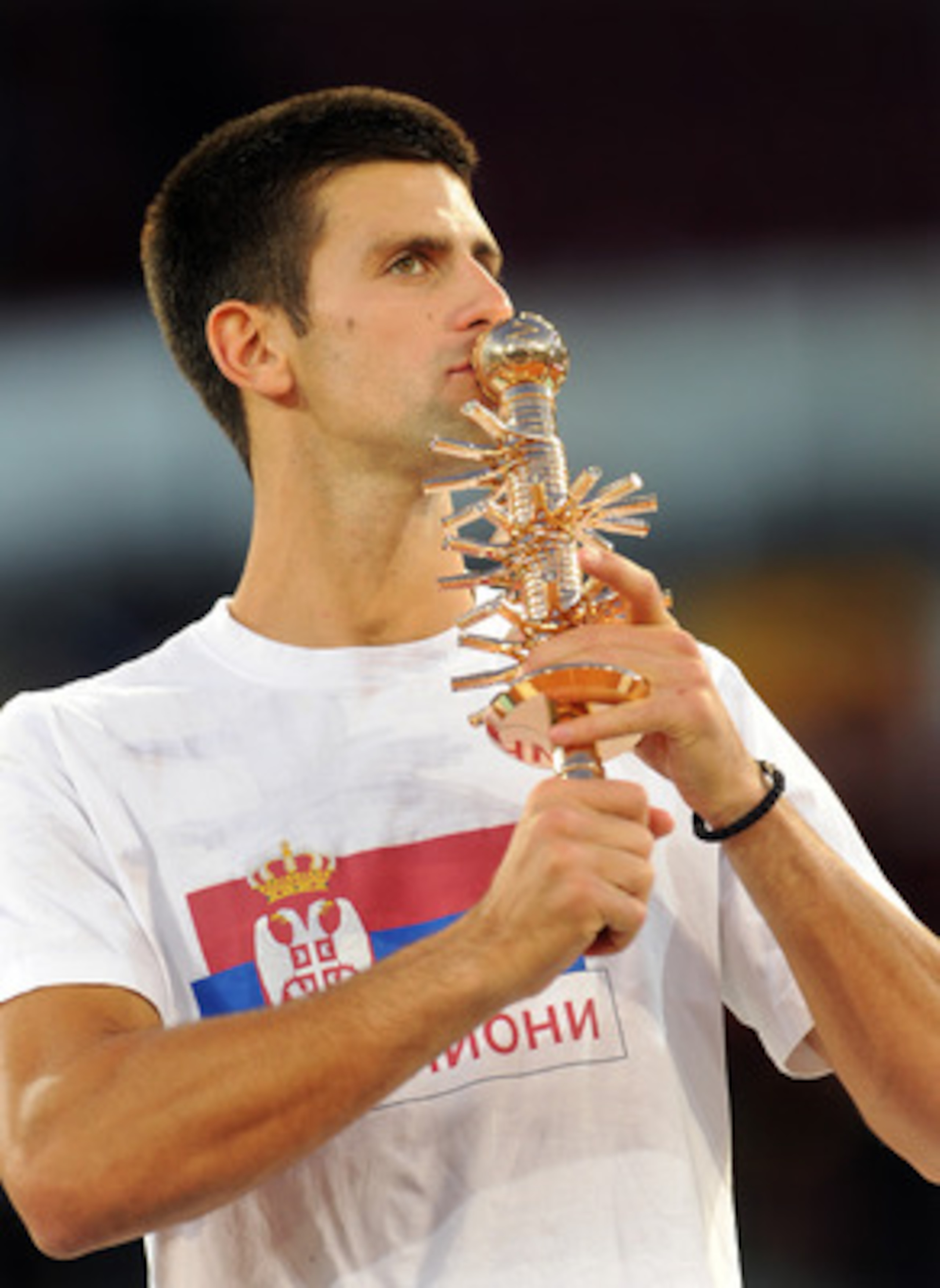 PARIS - NOVEMBER 15:  Novak Djokovic of Serbia lifts the winners trophy after winning the Final match against Gael Monfils of France during the ATP Masters Series at the Palais Omnisports De Paris-Bercy on November 15, 2009 in Paris, France.  (Photo by Cl
