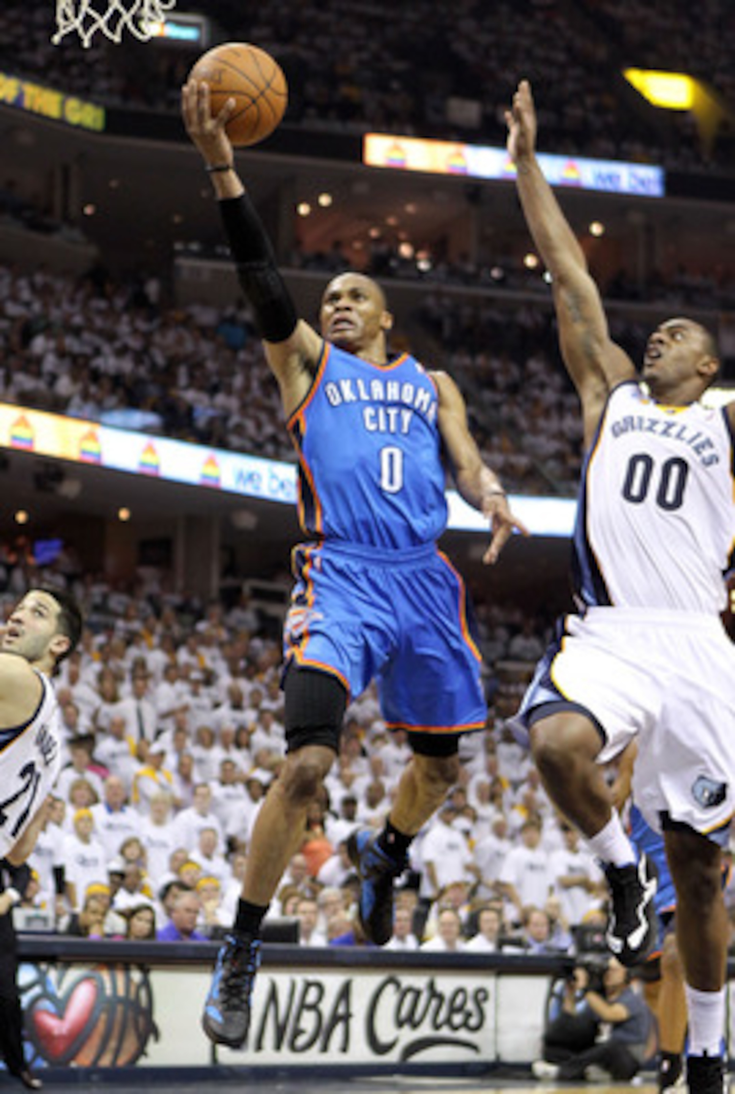 MEMPHIS, TN - MAY 09:  Russell Westbrook #0 of the Oklahoma City Thunder shoots the ball while defended by Darrell Arthur #00 of the Memphis Grizzlies in Game Four of the Western Conference Semifinals in the 2011 NBA Playoffs at FedExForum on May 9, 2011
