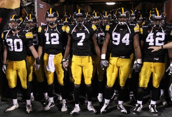 TEMPE, AZ - DECEMBER 28:  (L-R) De'Andre Johnson #30, Ricky Stanzi #12, Marvin McNutt #7, Adrian Clayborn #94 and Jeremiha Hunter #42 of the Iowa Hawkeyes prepare to take the field for the Insight Bowl against the Missouri Tigers at Sun Devil Stadium on D